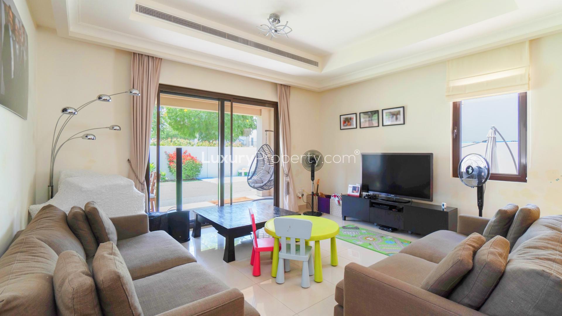 Beautiful 4-bedroom villa exterior in Rosa, Arabian Ranches 2, with garage and garden