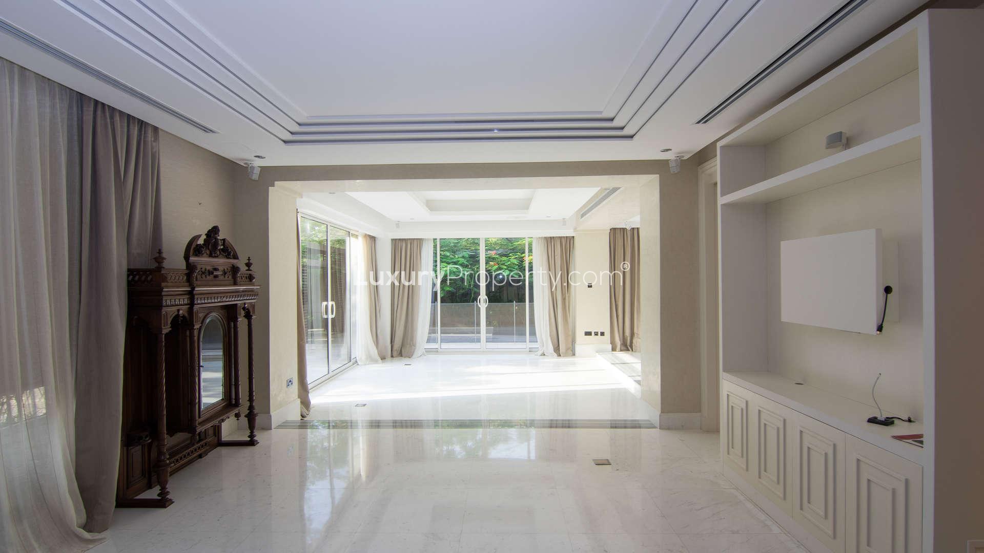 Luxurious living room in Saadiyat Beach villa with large windows and elegant decor