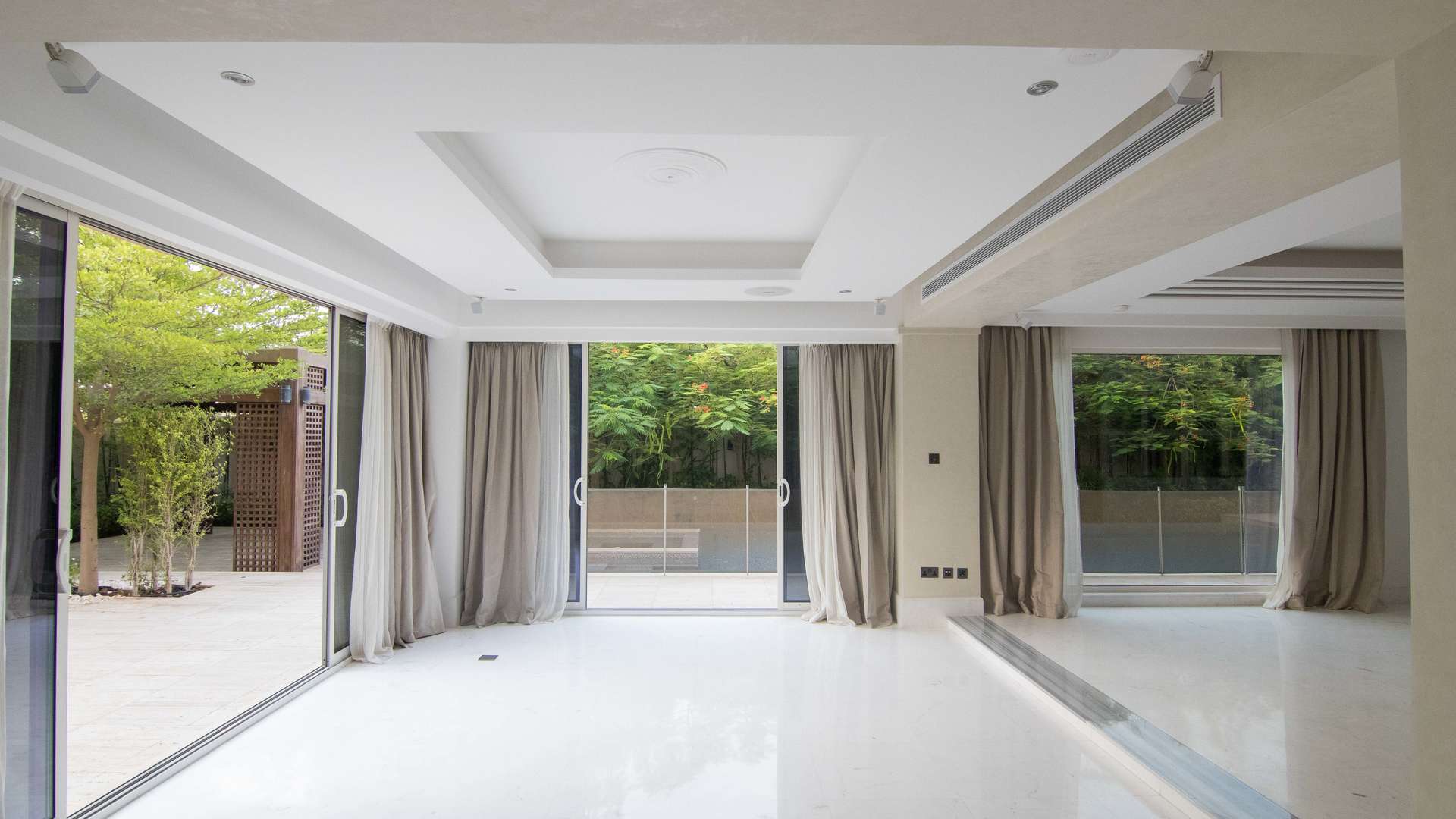 4 Bedroom Villa Exterior at Saadiyat Beach, Al Saadiyat Island, Abu Dhabi for Sale,Bright, spacious living room with large windows in Saadiyat Beach Villa, Abu Dhabi