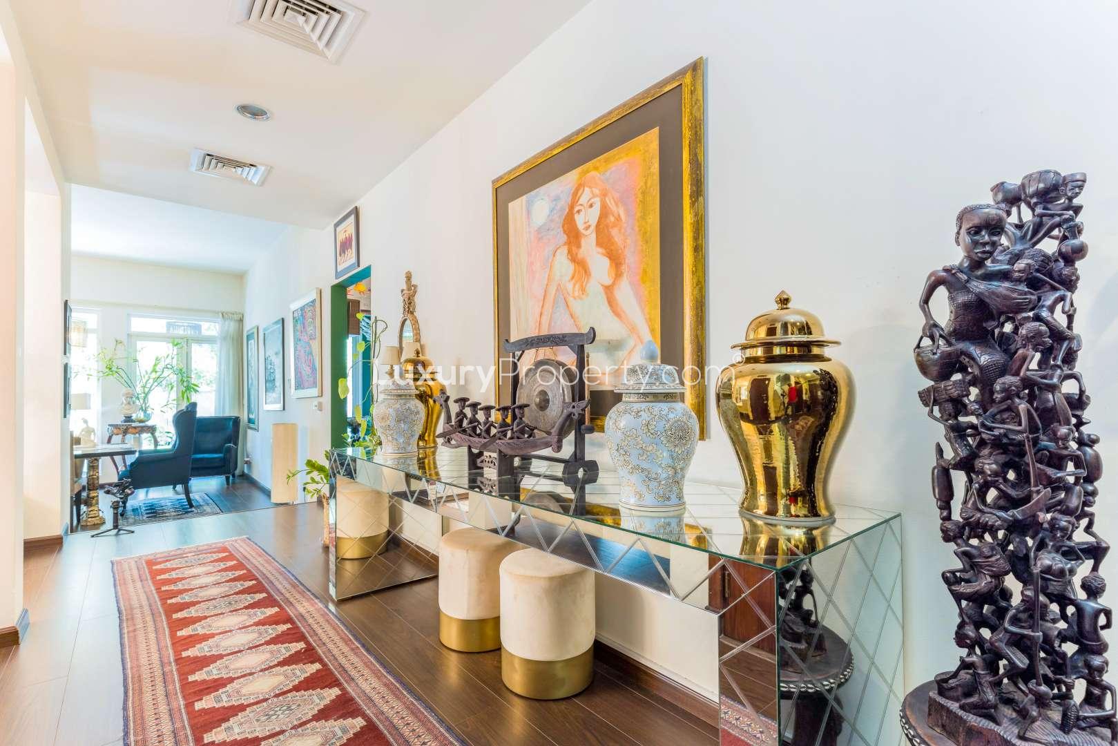Elegant bathroom in Saheel villa, featuring ornate mirror and modern fixtures
