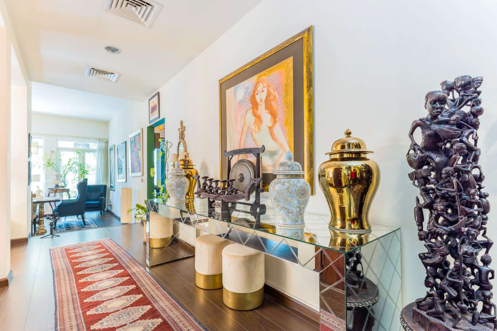 Elegant bathroom in Saheel villa, featuring ornate mirror and modern fixtures