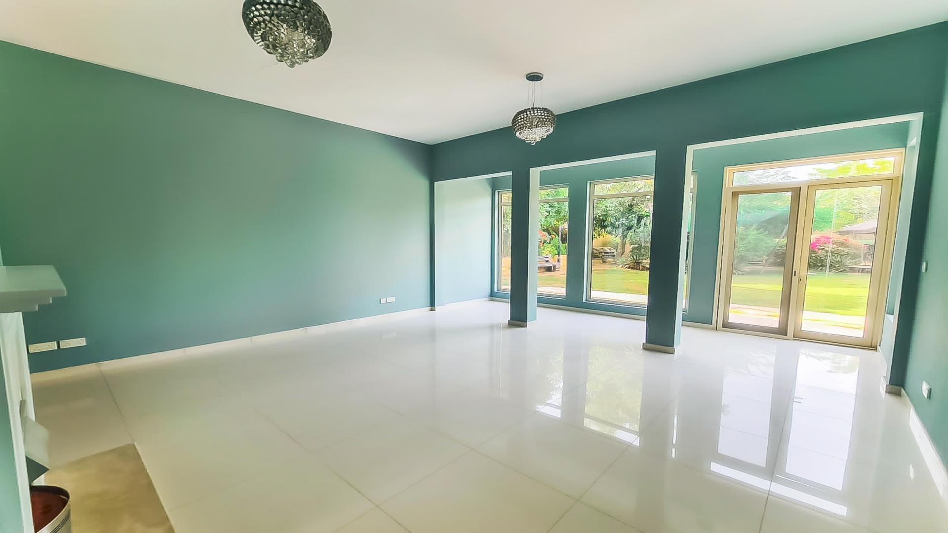 Spacious kitchen in 4-bedroom villa, Saheel, Arabian Ranches, with modern cabinets and countertops