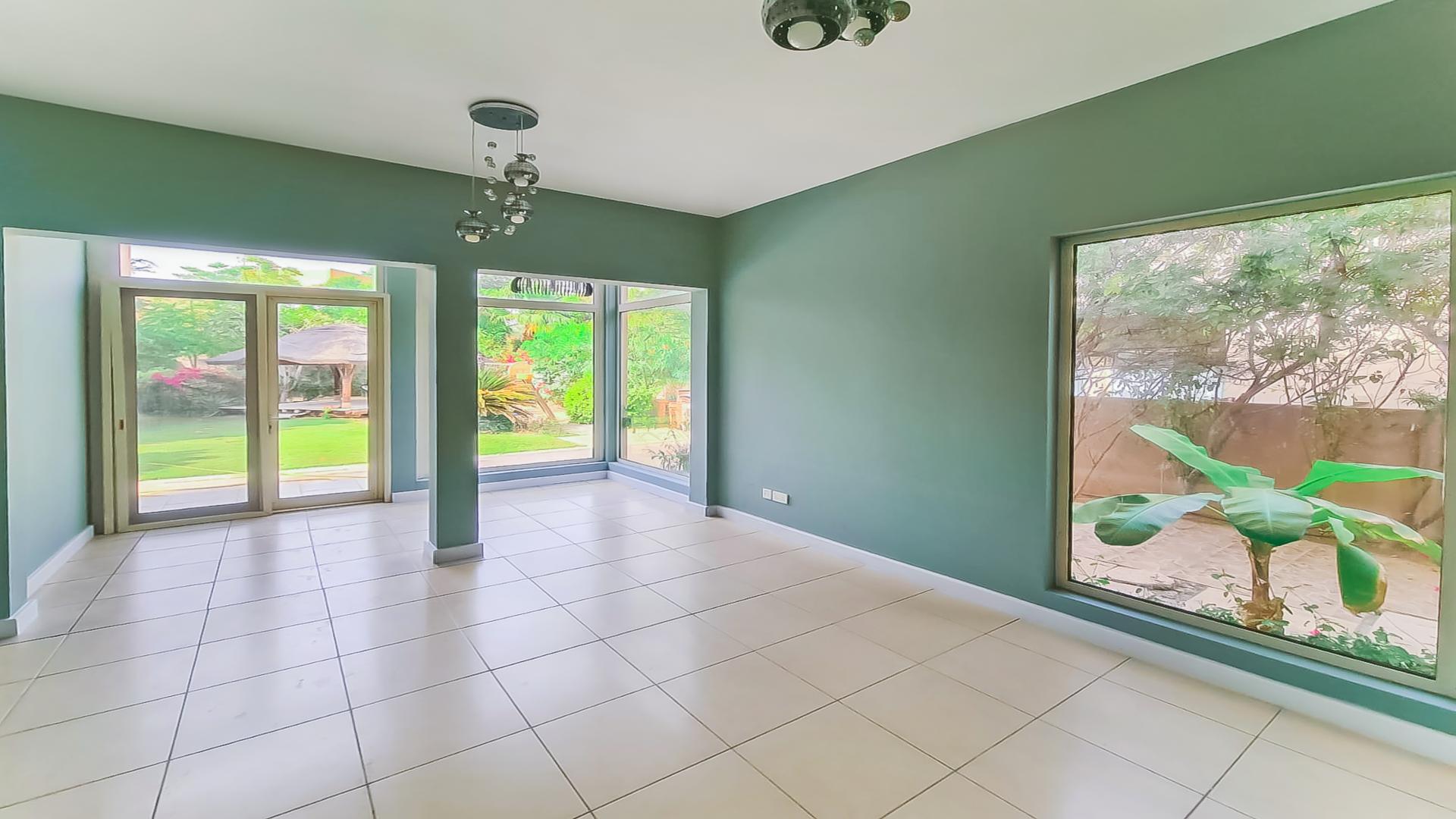 Beautiful 4-bedroom villa exterior with lush garden in Saheel, Arabian Ranches for rent