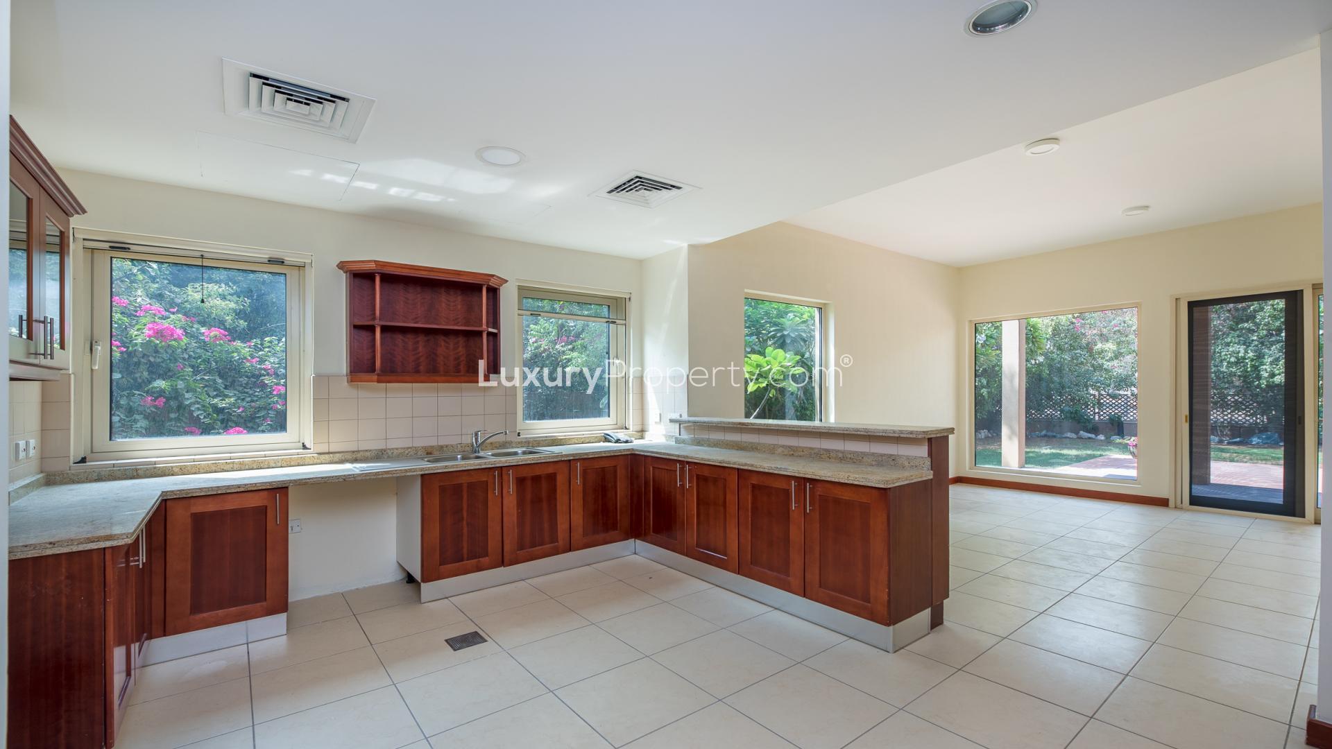 Spacious living room with fireplace in Saheel villa, Arabian Ranches, Type 8 home for sale