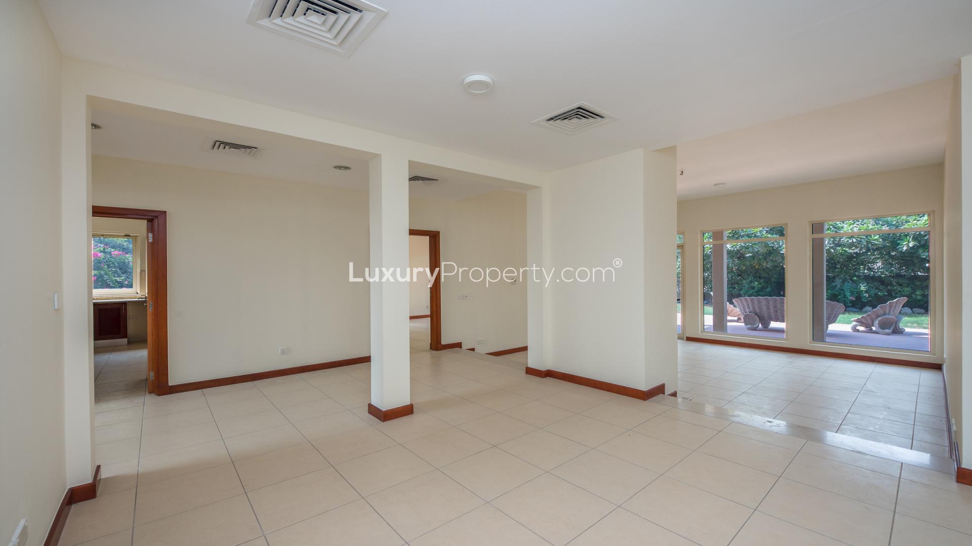 Spacious kitchen in Type 8 villa, Saheel, Arabian Ranches, featuring garden views and modern design