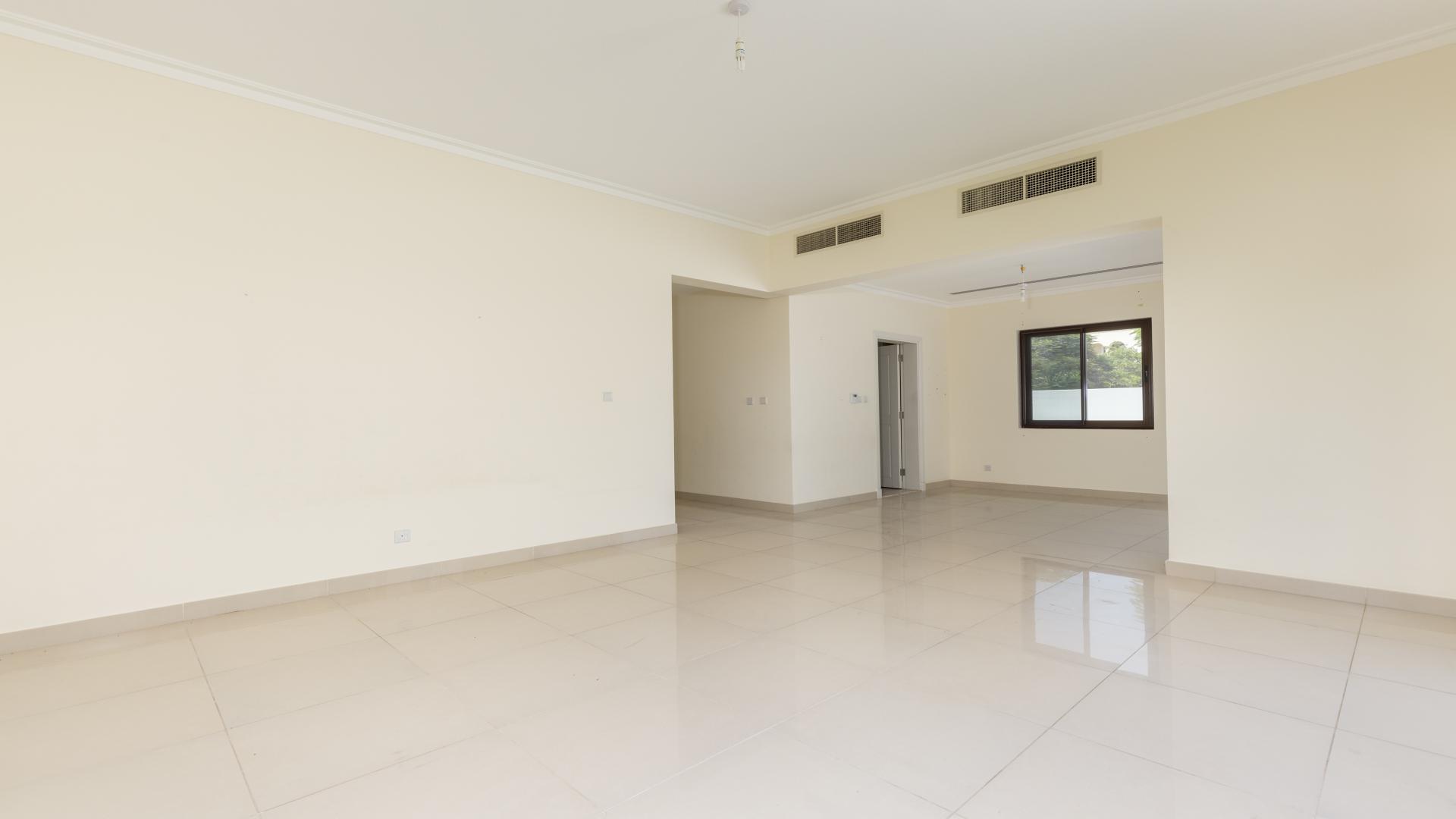Spacious living area in Samara villa, Arabian Ranches 2, featuring tiled floors and large window