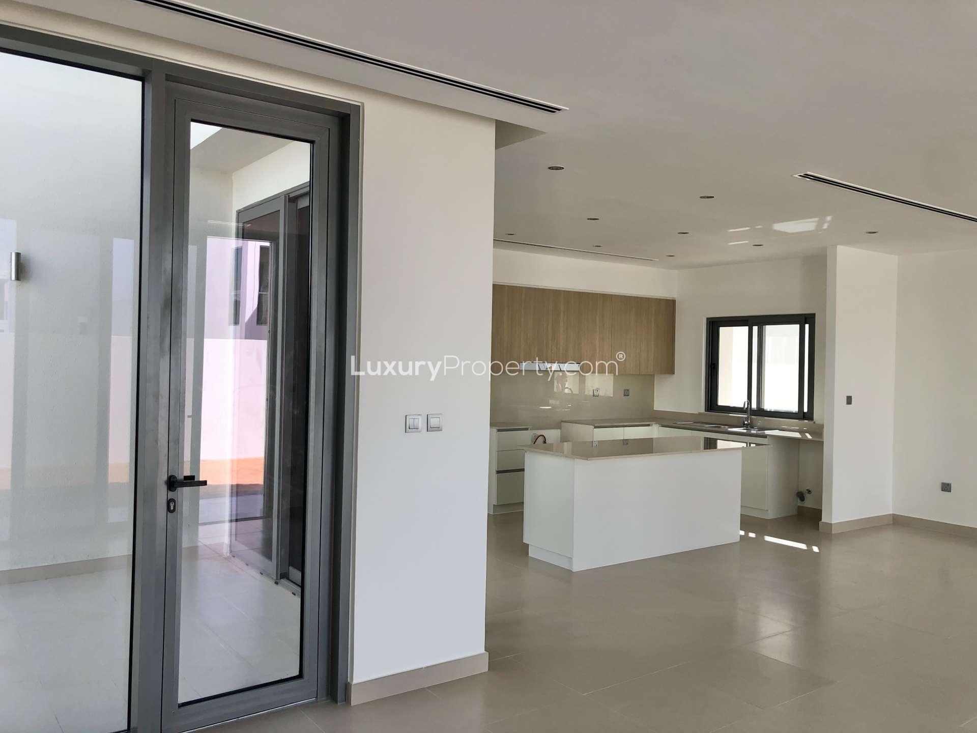 Modern kitchen and living area in Dubai Hills Estate's Sidra 3 villa for sale