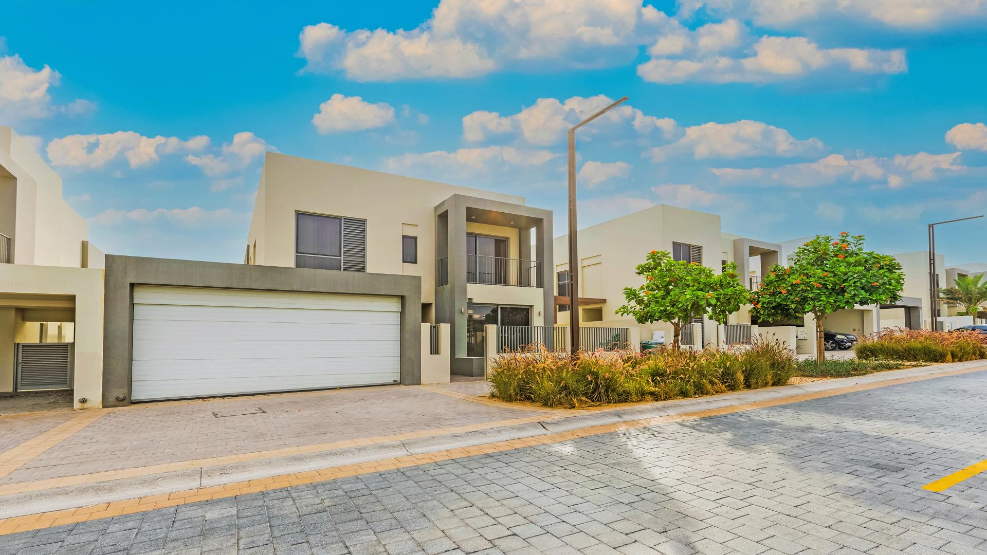 Exterior view of luxury 4-bedroom villa in Sidra, Dubai Hills Estate, with lush garden