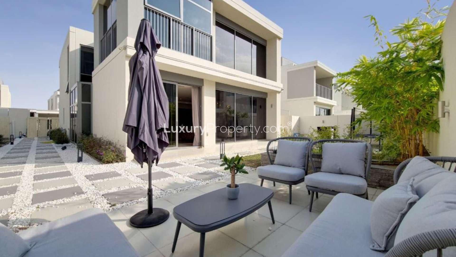 Contemporary living room in Sidra Villas, Dubai Hills Estate, featuring modern decor and large windows
