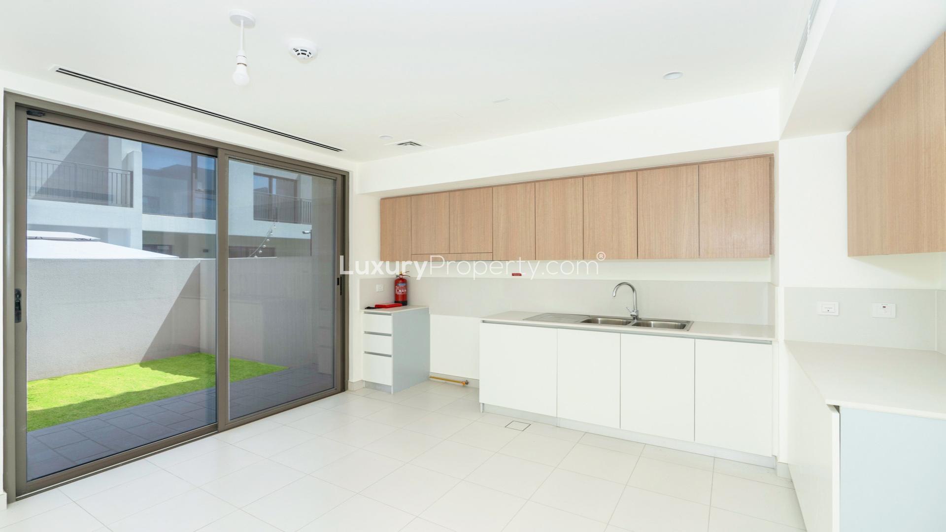 Spacious living area with large windows in 4-bedroom villa, EMAAR South, Dubai South