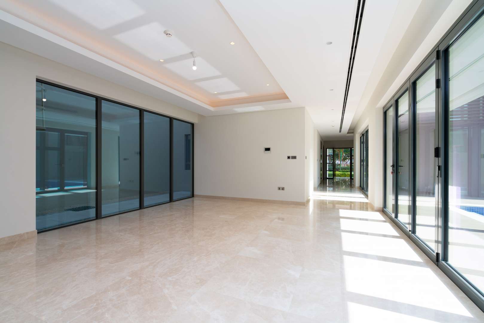 Luxurious villa interior with floor-to-ceiling windows at Sobha Hartland Estates, Dubai