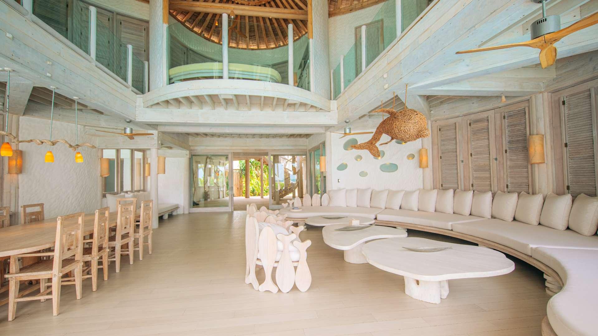 Luxurious beachfront villa interior with pool view in Soneva Jani, Noonu Atoll