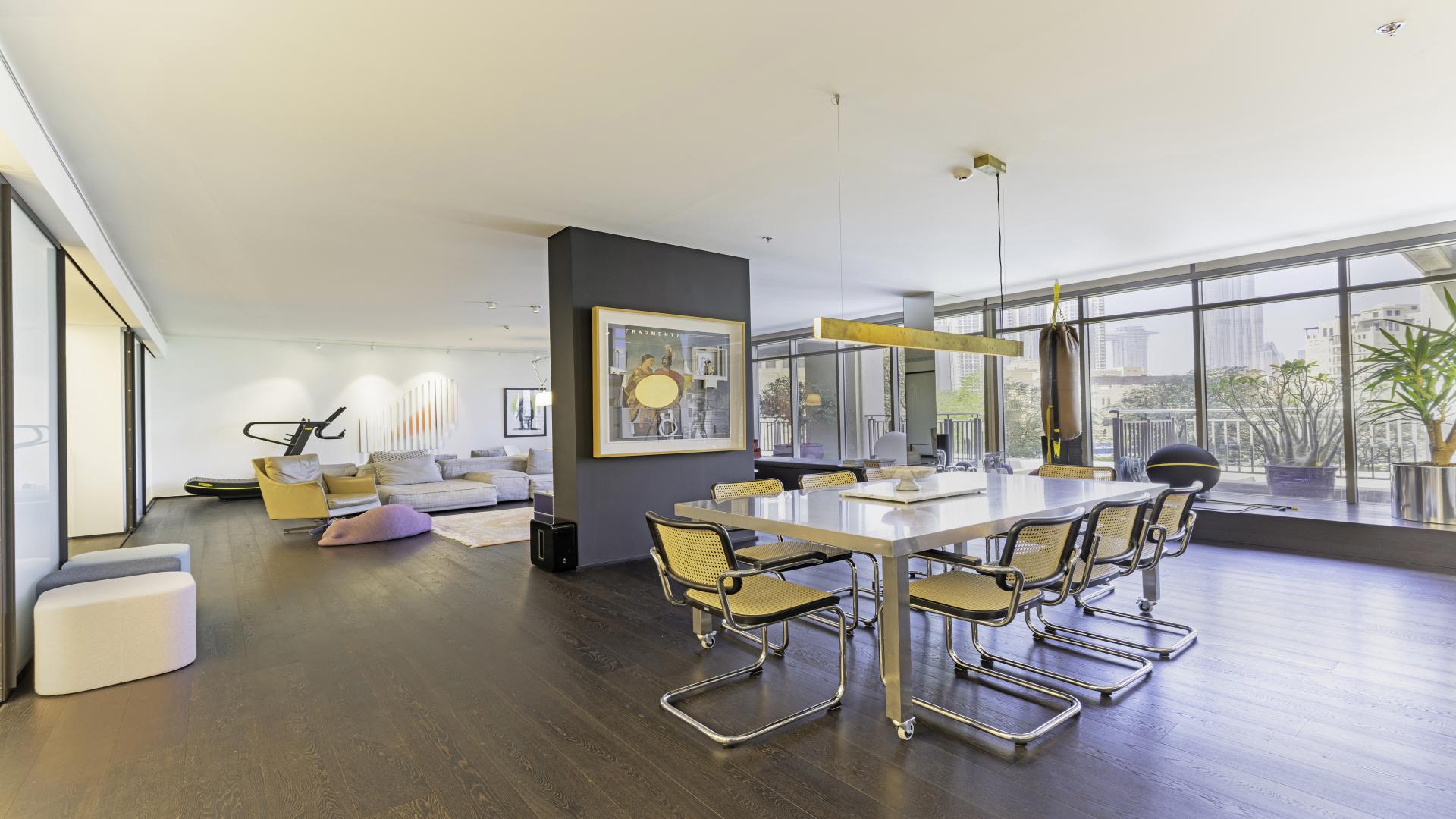 Alt text: "Balcony view of Downtown Dubai skyline from luxury villa in South Ridge community.",Luxurious living room in upgraded 6-bedroom villa, Downtown Dubai, South Ridge community