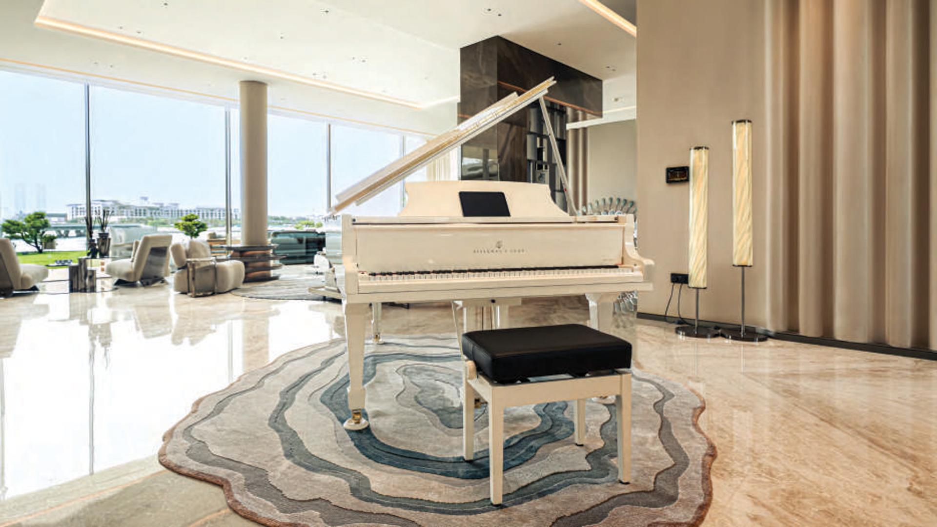 Luxurious kitchen in Bvlgari Mansion, Jumeirah Bay Island villa with modern design and garden view