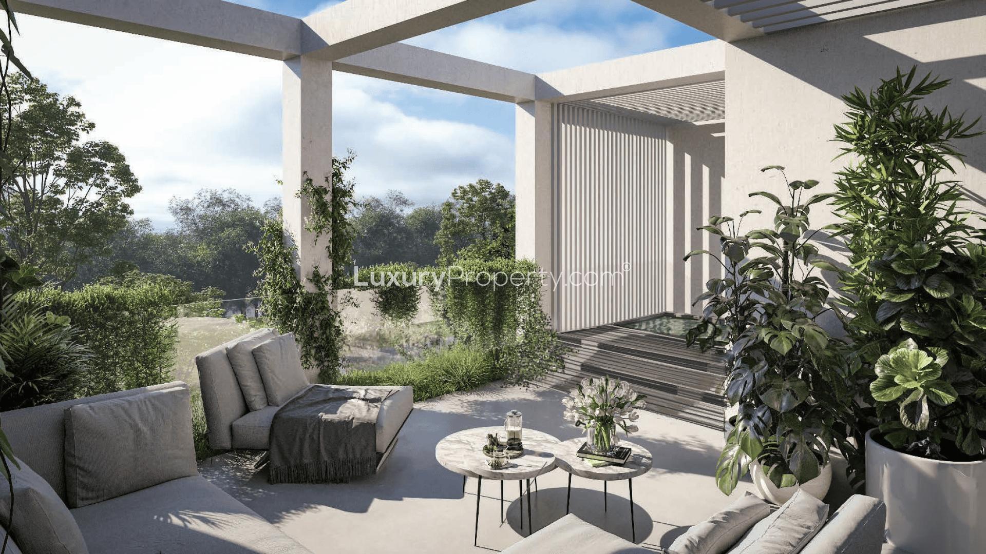 Luxurious living room in Ixora townhouse, Al Barari, with modern decor and elegant finishes