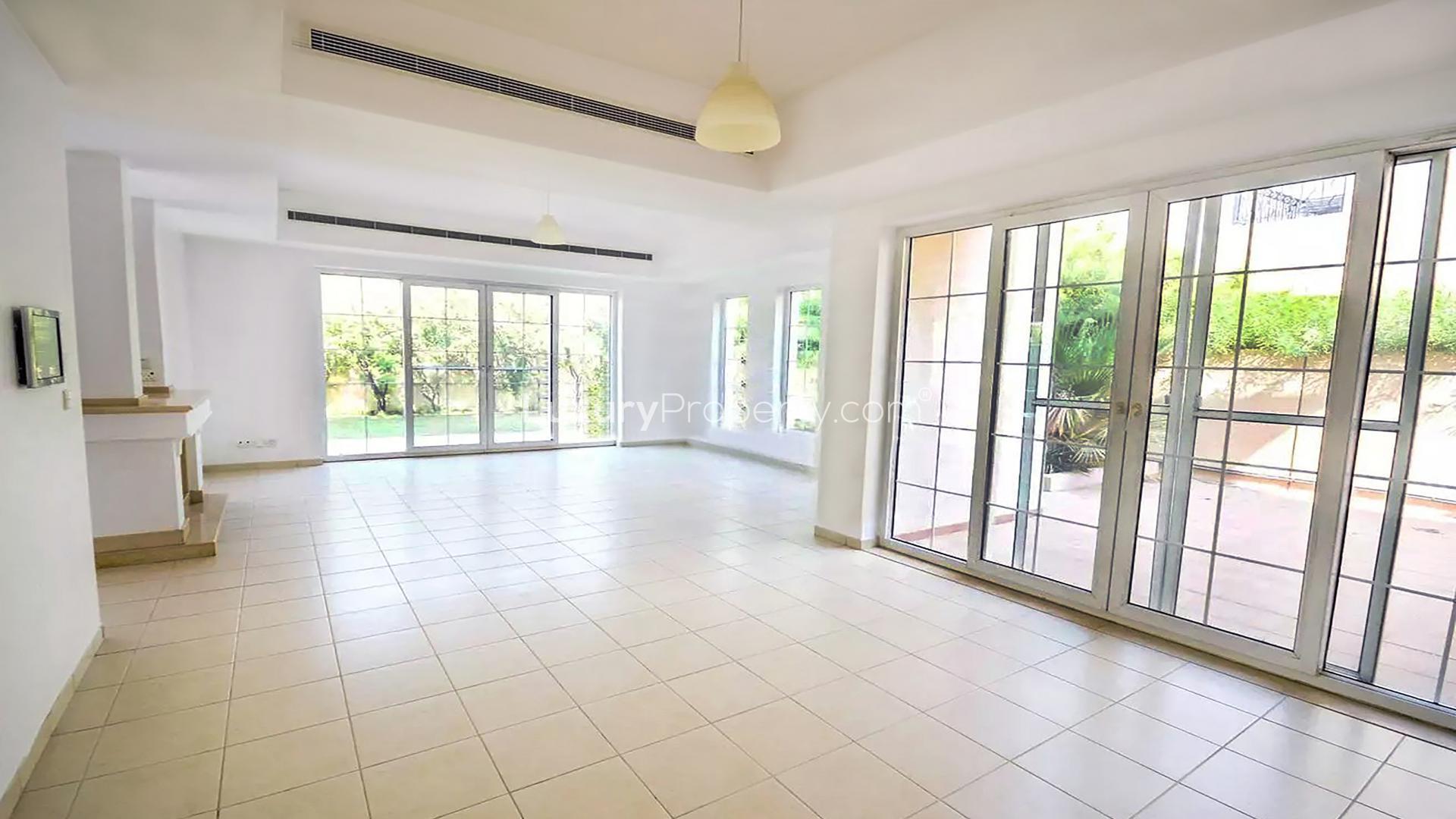 Bright, spacious living area with large windows in Terra Nova villa, Arabian Ranches