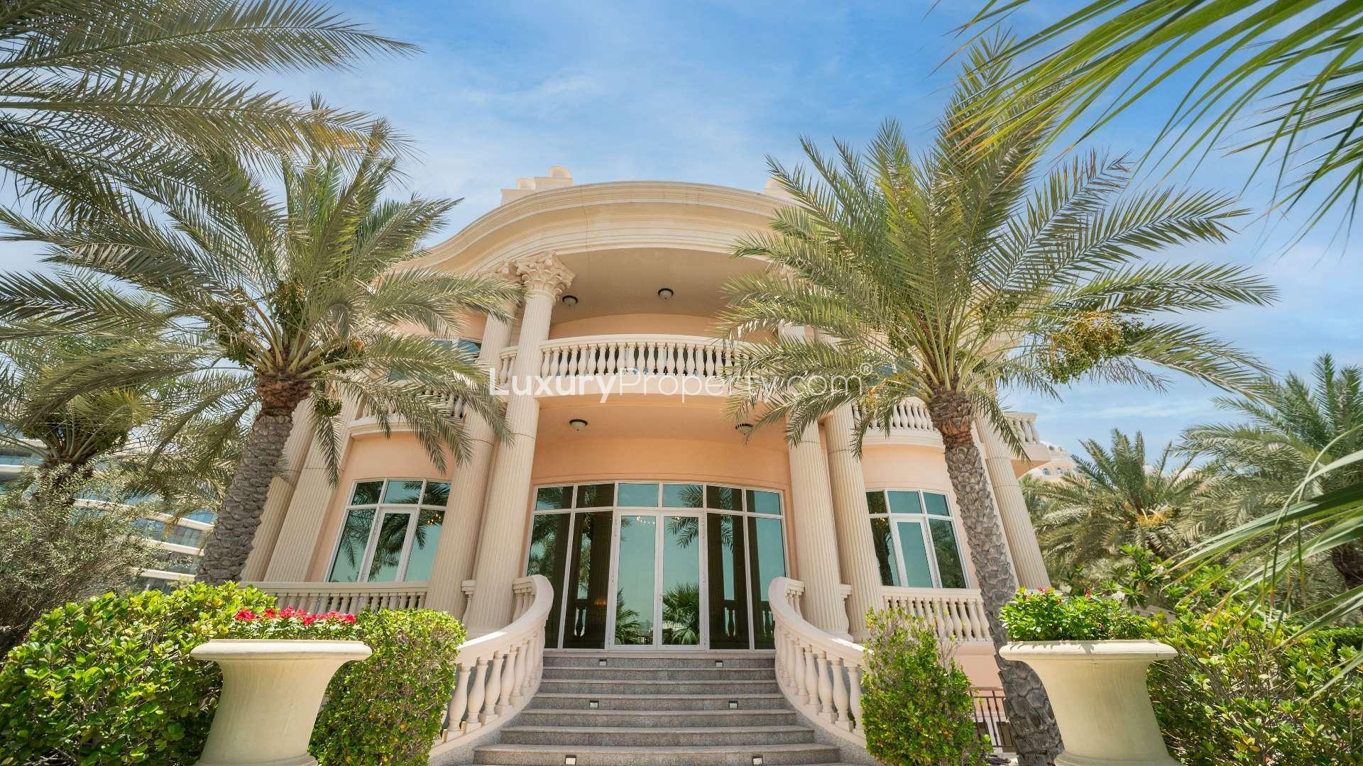 European-style villa exterior with grand columns, lush greenery, Palm Jumeirah, The Crescent