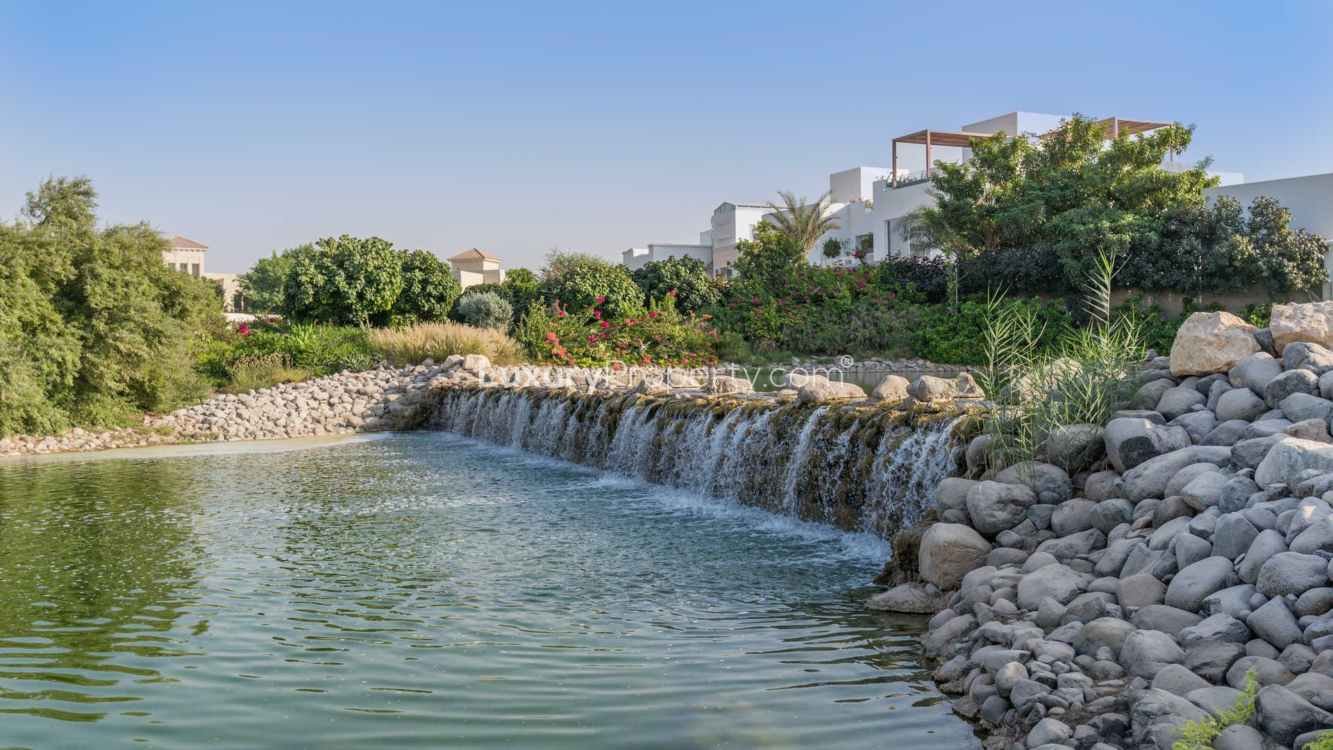 Luxurious villa view by the serene lake in The Nest, Al Barari community