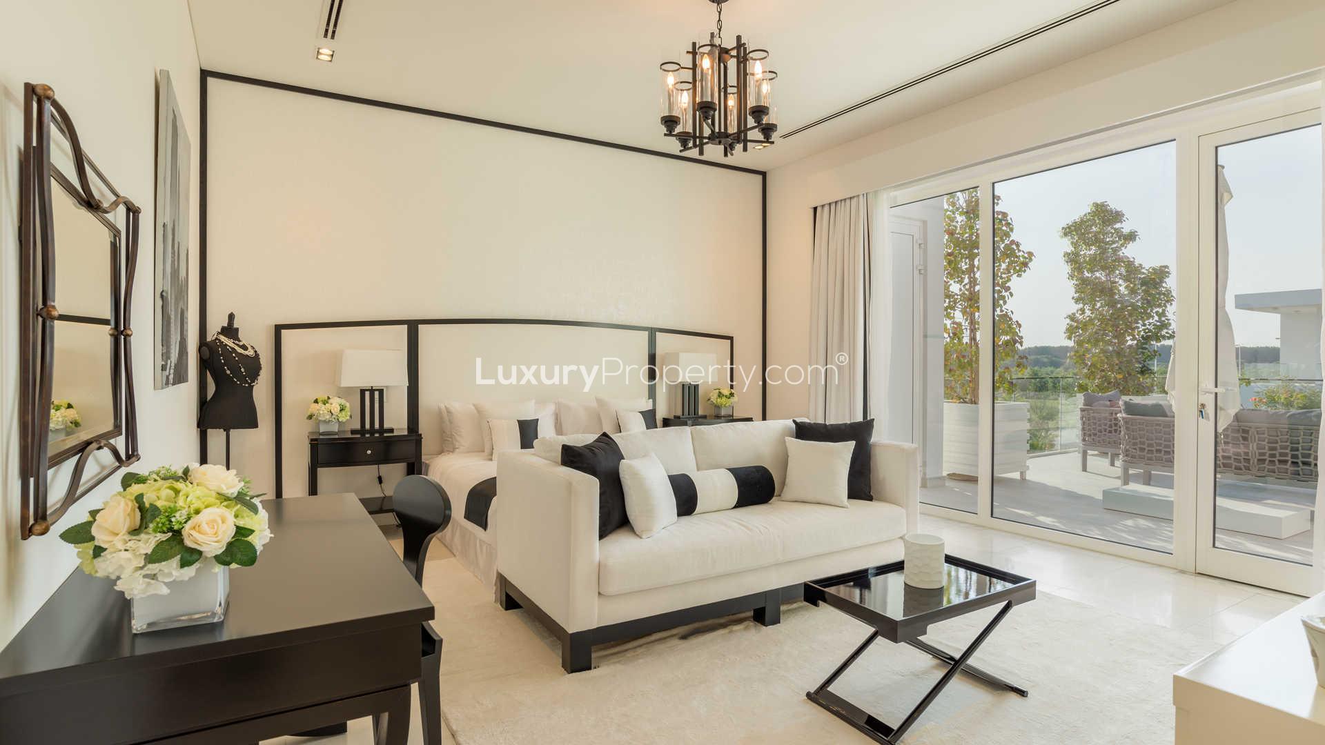 Waterfall and lush greenery in The Nest, Al Barari villa community