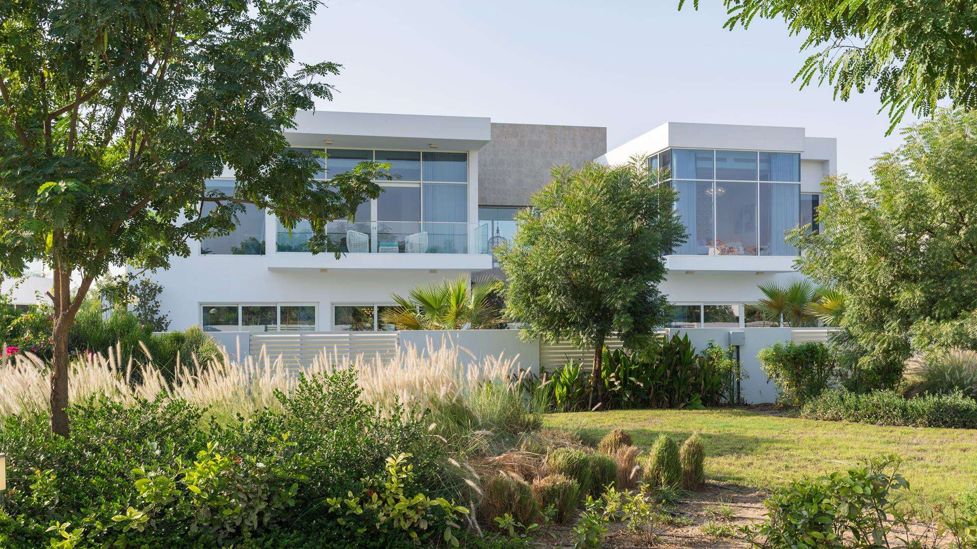 Waterfall and lush garden in The Nest, Al Barari, Dubai villa community