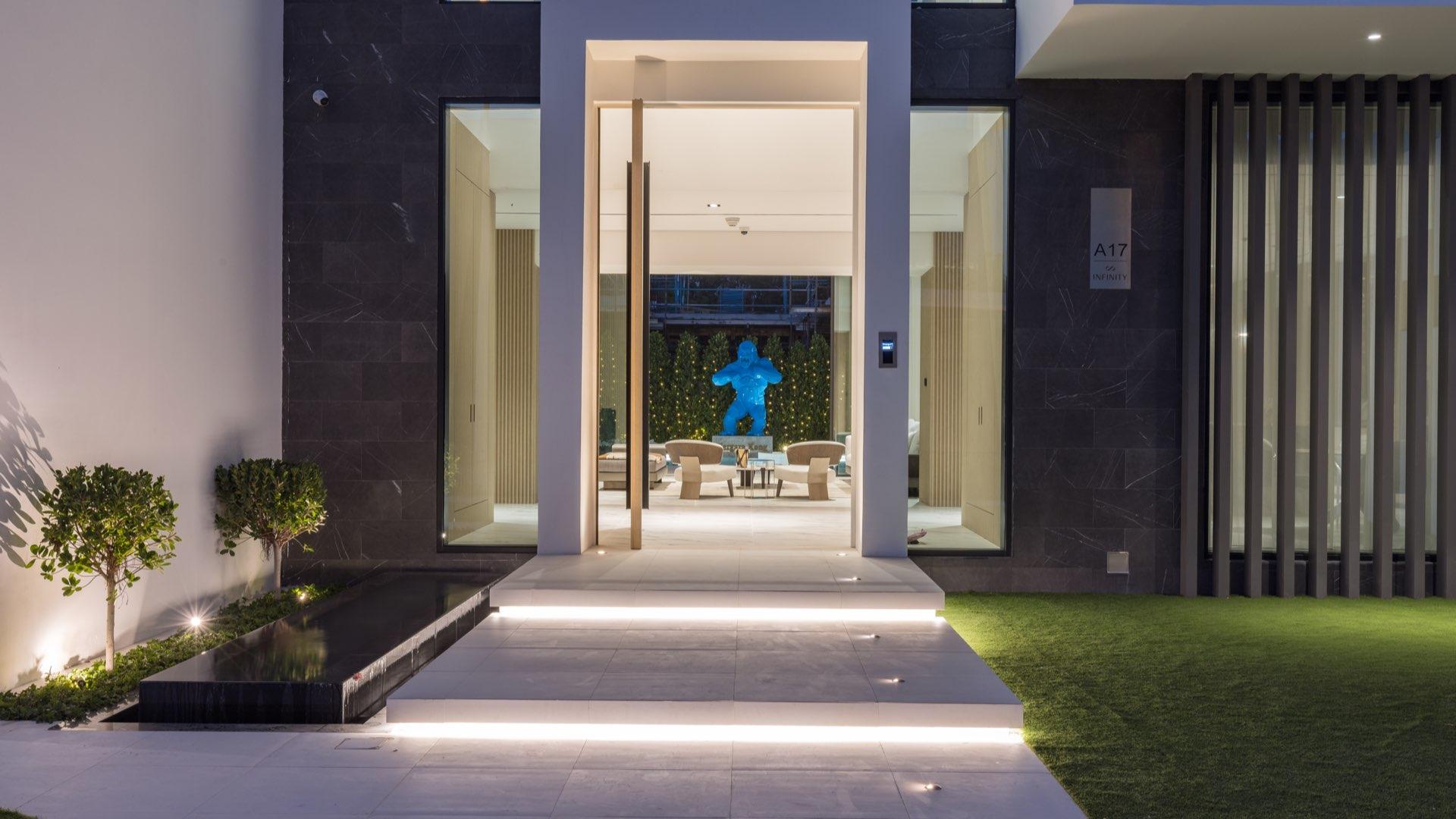 Exterior view of luxury 4-bedroom villa with pool in Al Barari, The Nest