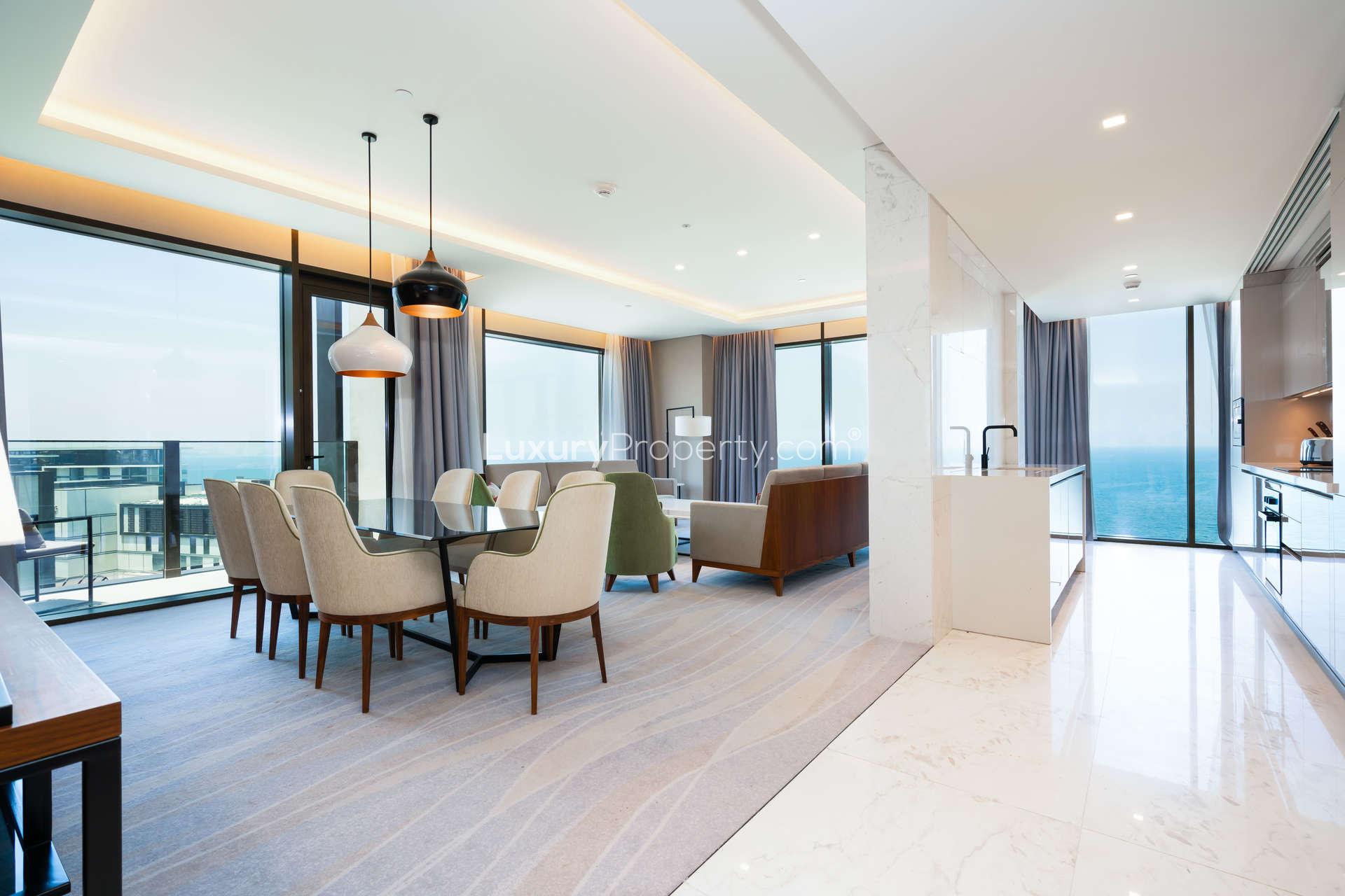 Luxurious beachfront apartment view at Caesars Bluewaters Dubai with pool and ocean scenery