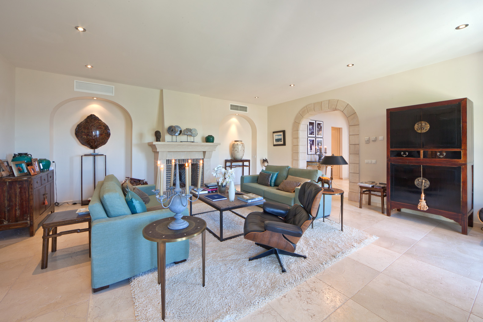 Living room in Spanish villa, Port d'Andratx, Mallorca, with elegant decor and fireplace