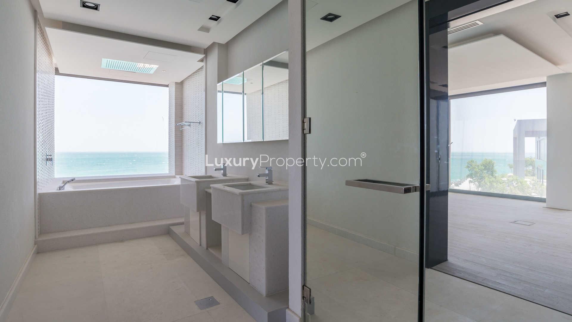 Luxurious beachfront villa bathroom with ocean view, Zaya Nurai Island, Water Villa