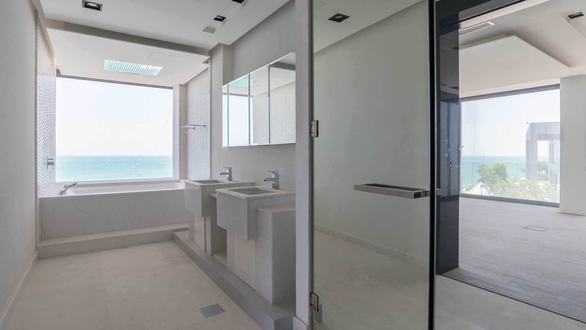 Luxurious beachfront villa bathroom with ocean view, Zaya Nurai Island, Water Villa