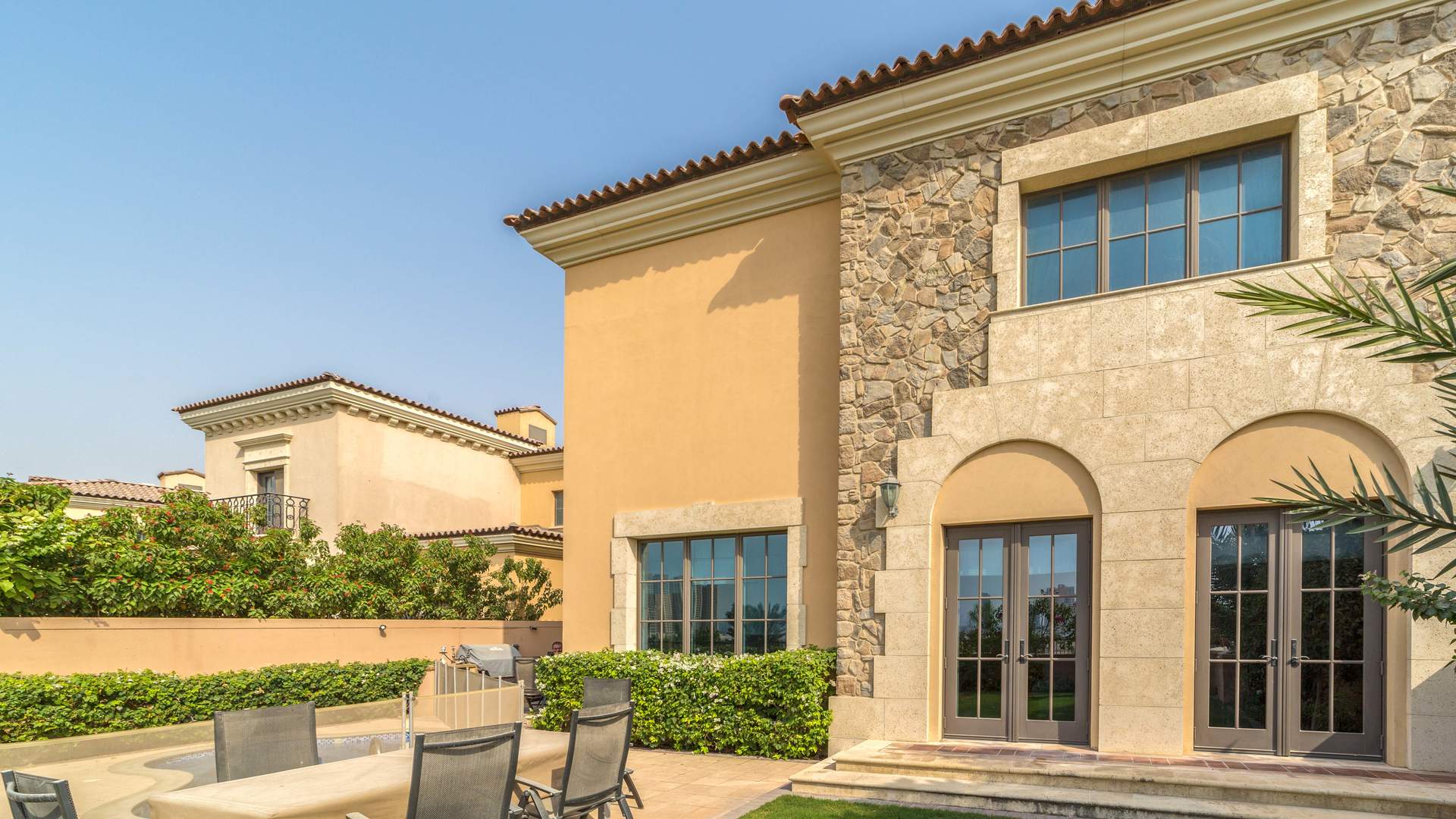Luxurious bathroom in Whispering Pines villa, Jumeirah Golf Estates, featuring wooden cabinets