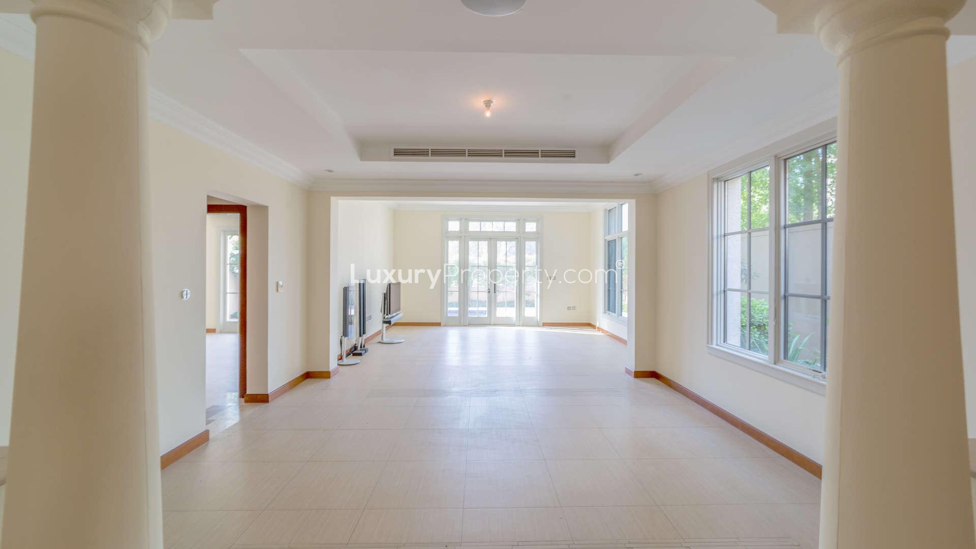 Luxurious villa exterior with garage in Jumeirah Golf Estates, Earth community, for sale