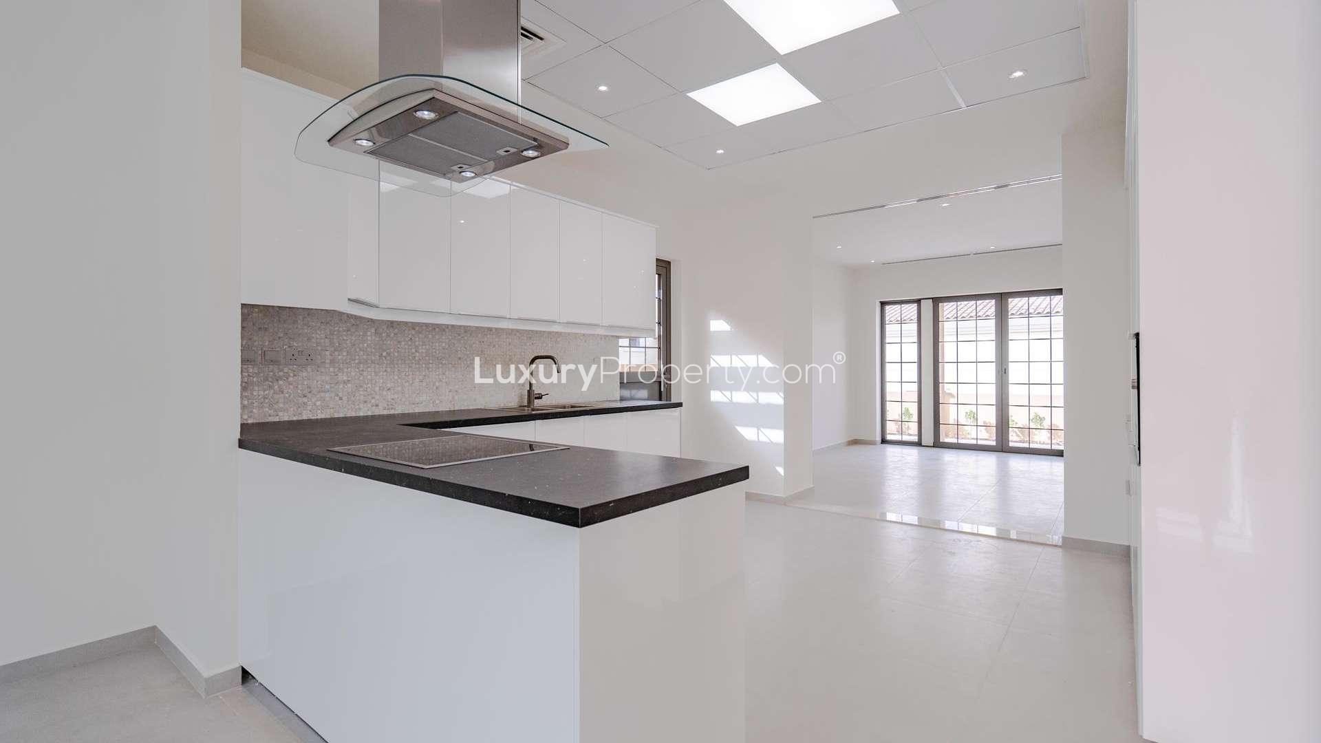 Spacious living area with large windows in 4-bedroom villa, Whispering Pines, Jumeirah Golf Estates