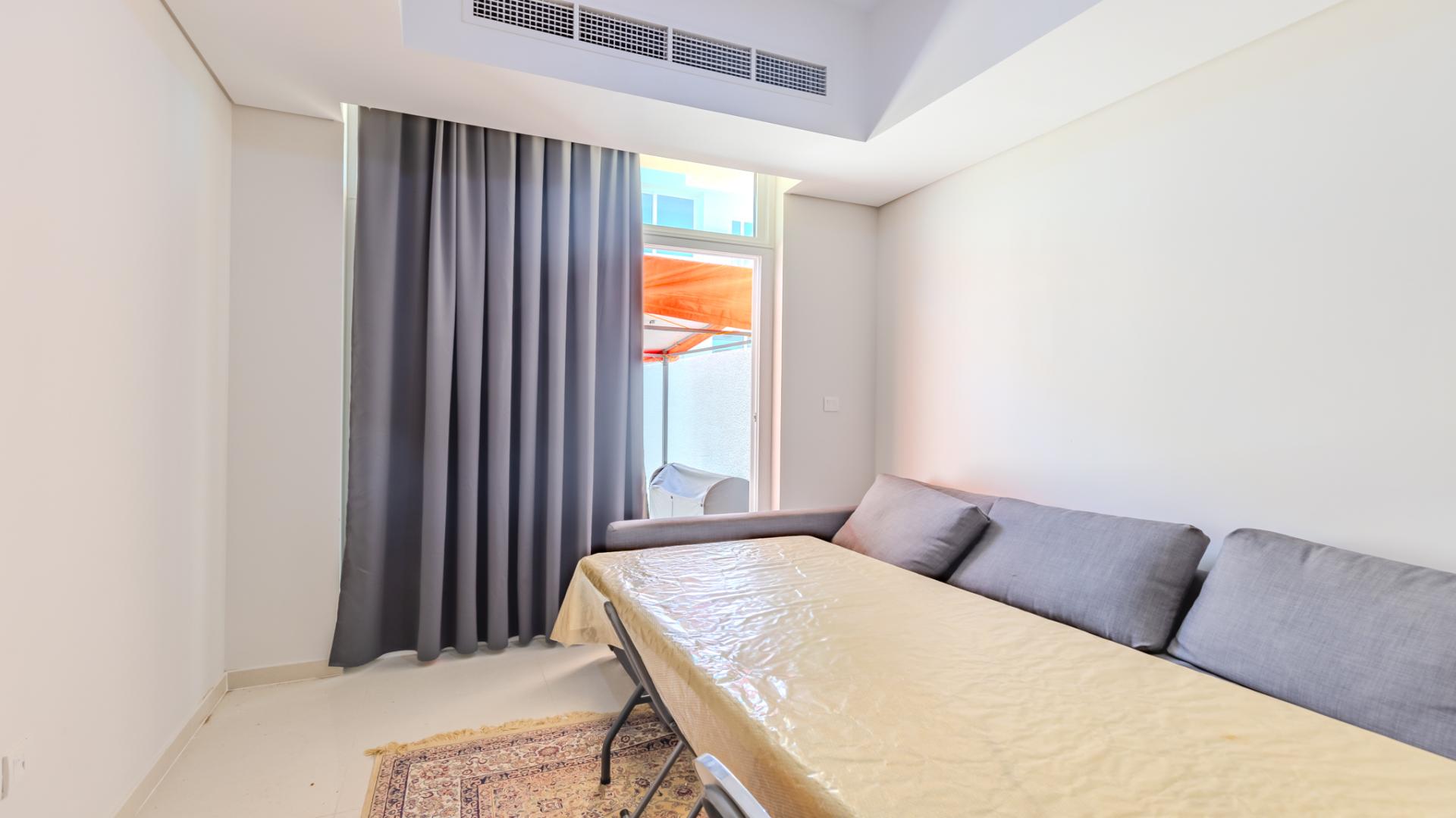 Modern living room in 4-bed townhouse at Damac Hills 2, Avencia 2 for sale