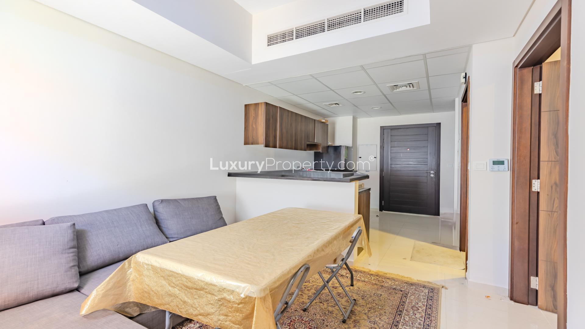 "Spacious balcony view of modern townhouse at Damac Hills 2, Avencia 2 community.",Modern kitchen and dining area in 4-bed townhouse, Damac Hills 2, Avencia 2