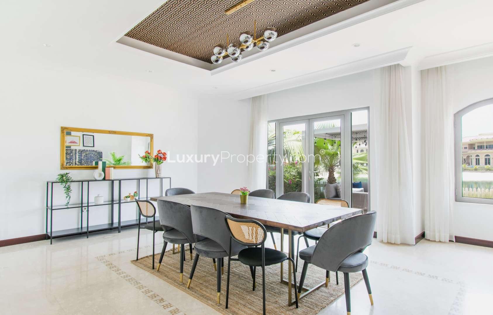 Furnished living room in Palm Jumeirah villa, featuring modern decor and waterfront views