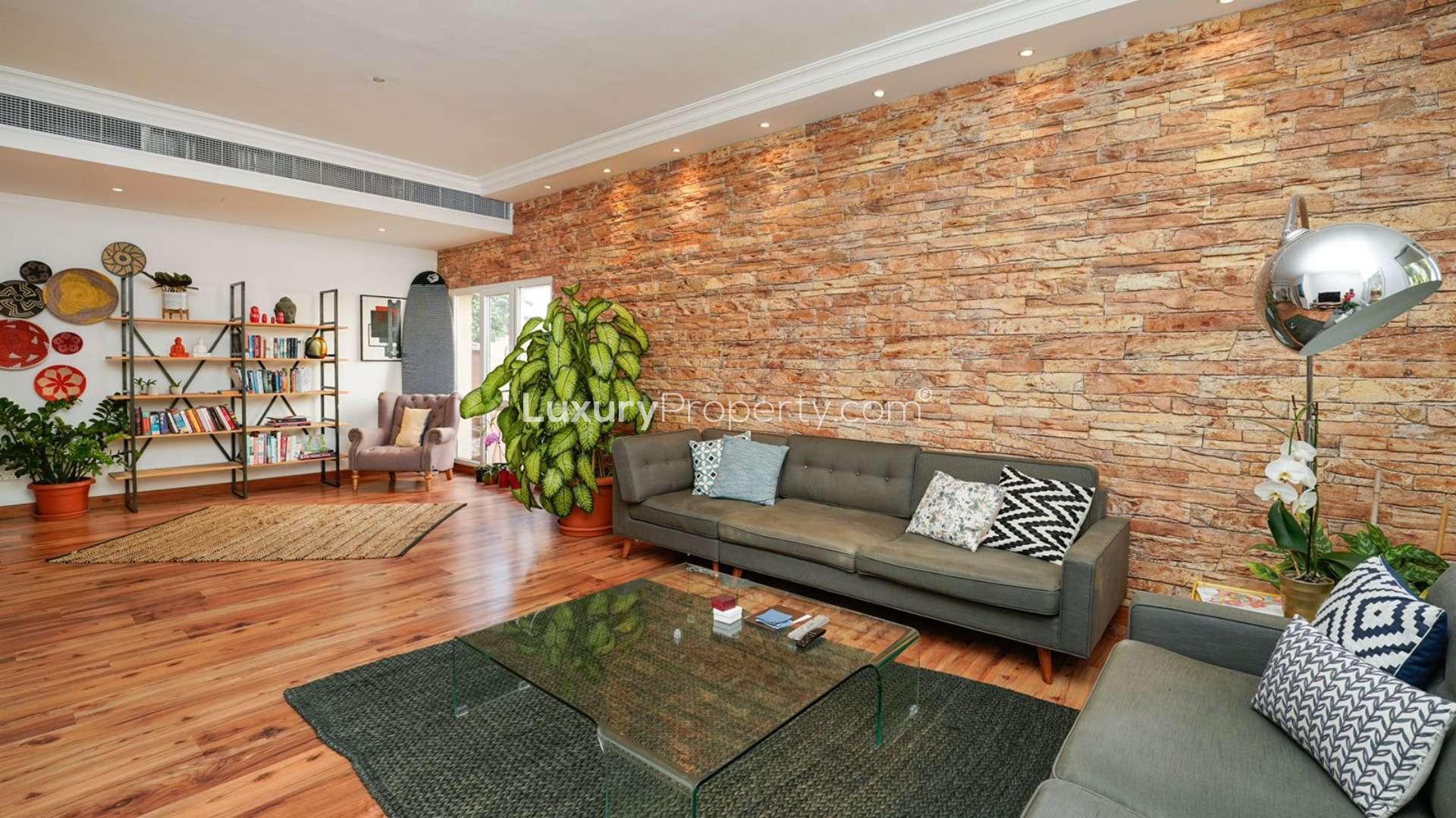 Contemporary Meadows 6 villa with private pool, lush garden, and modern patio furniture