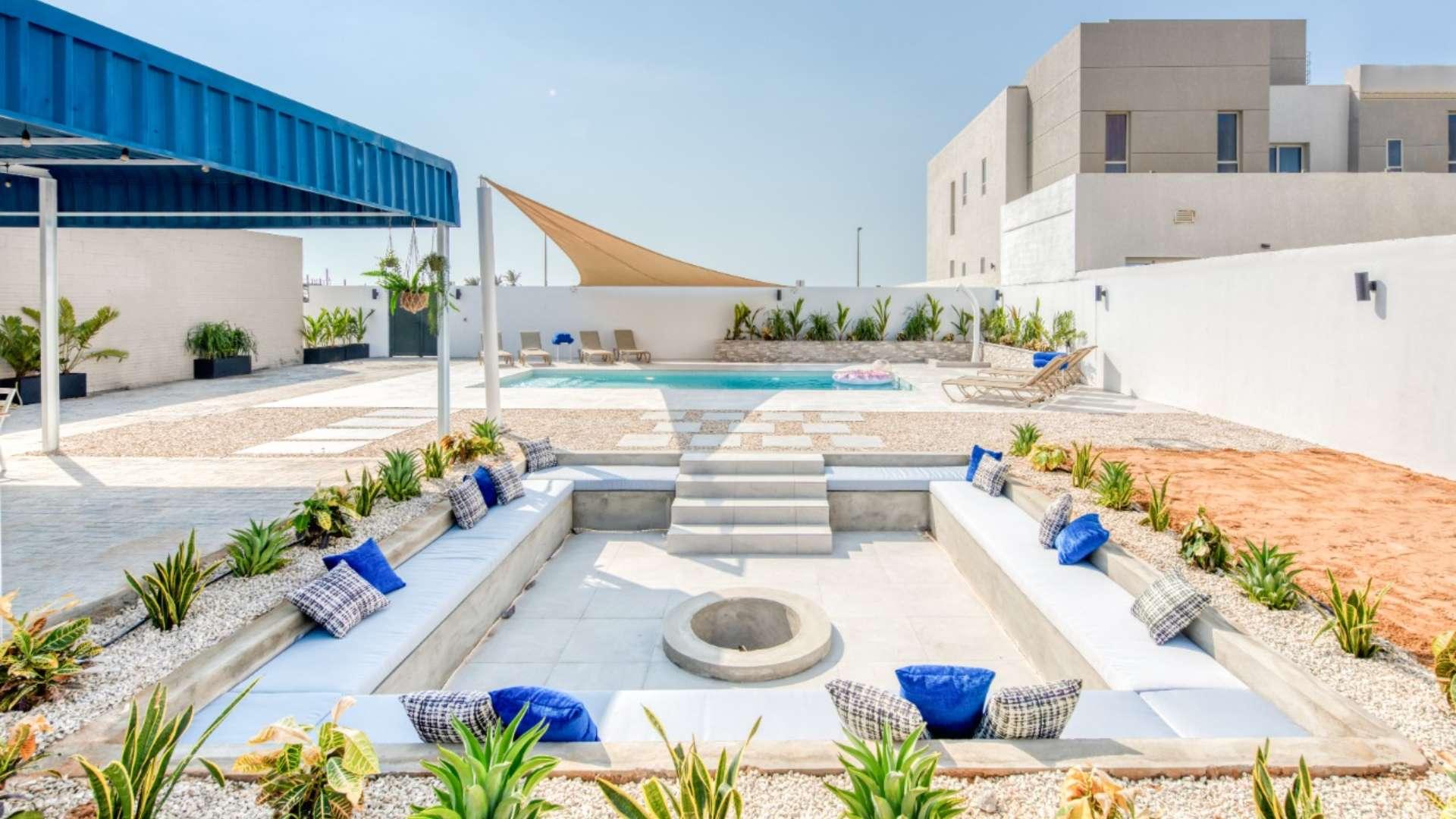 Modern living room in spacious beachfront villa, Umm Suqeim, featuring stylish decor and furniture