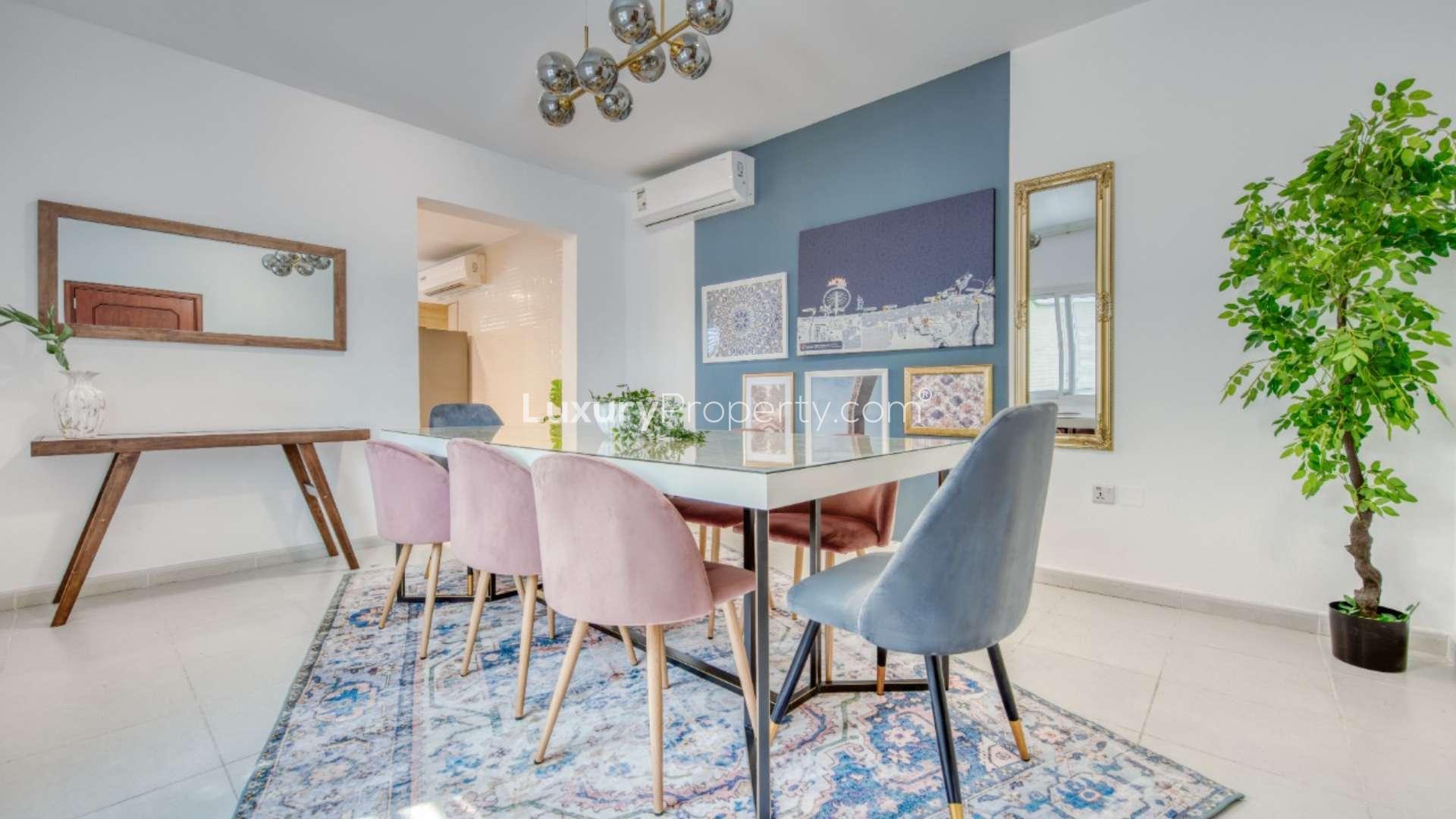 Modern living room in spacious beachfront villa, Umm Suqeim, with colorful decor and cozy seating