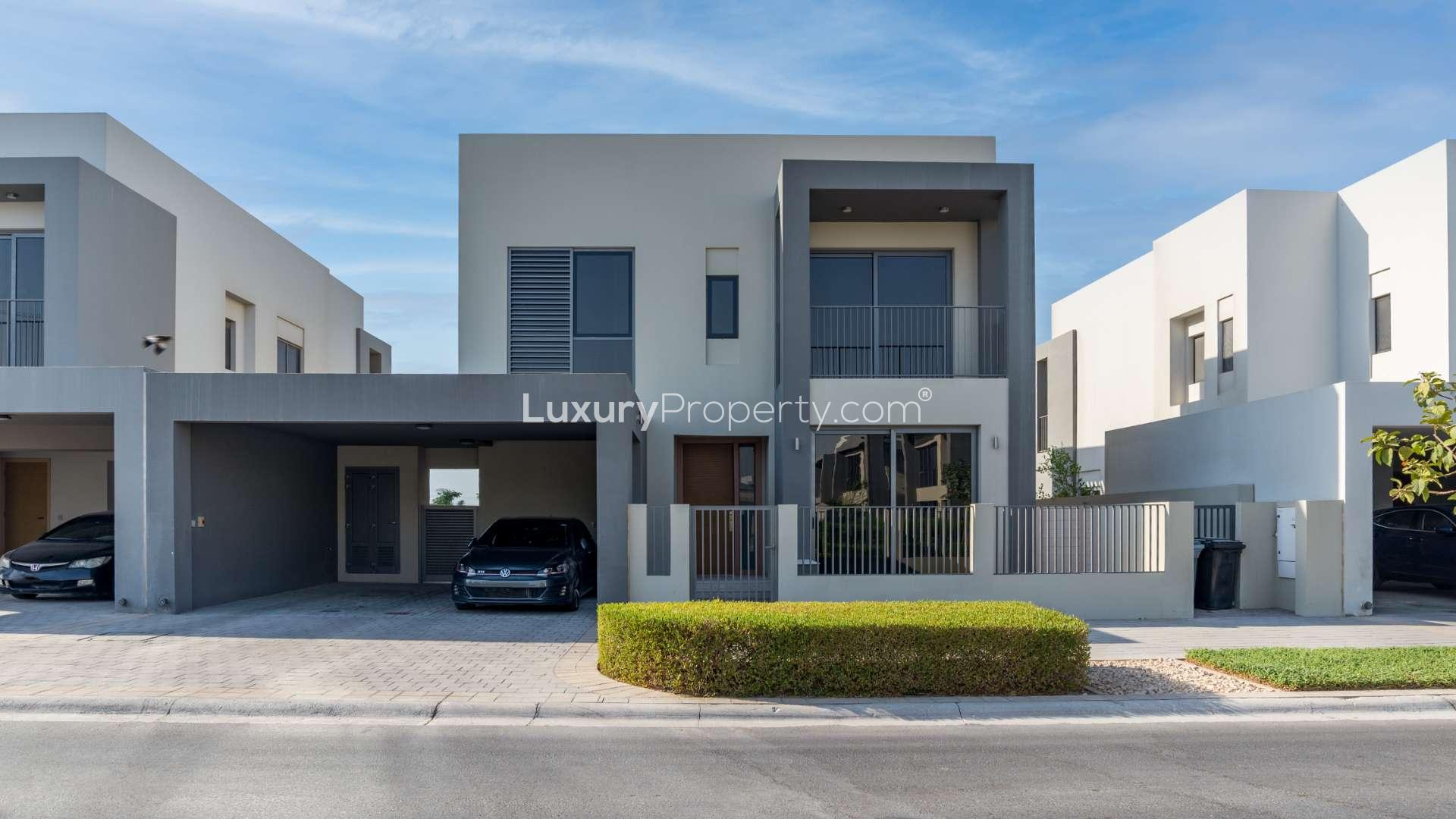 Modern living area in 4-bedroom villa, Sidra, Dubai Hills Estate, with sleek glass railing