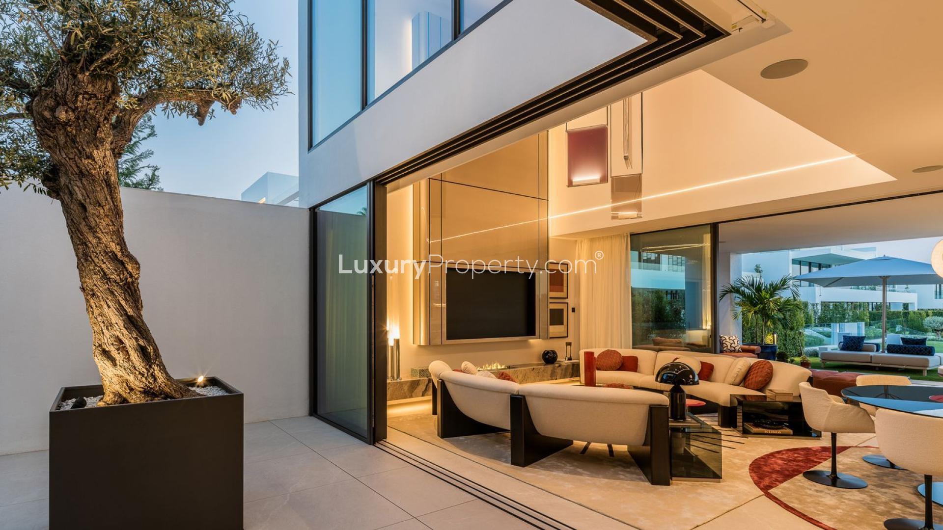 Modern villa terrace with pool and sea views in Marbella's Golden Mile community