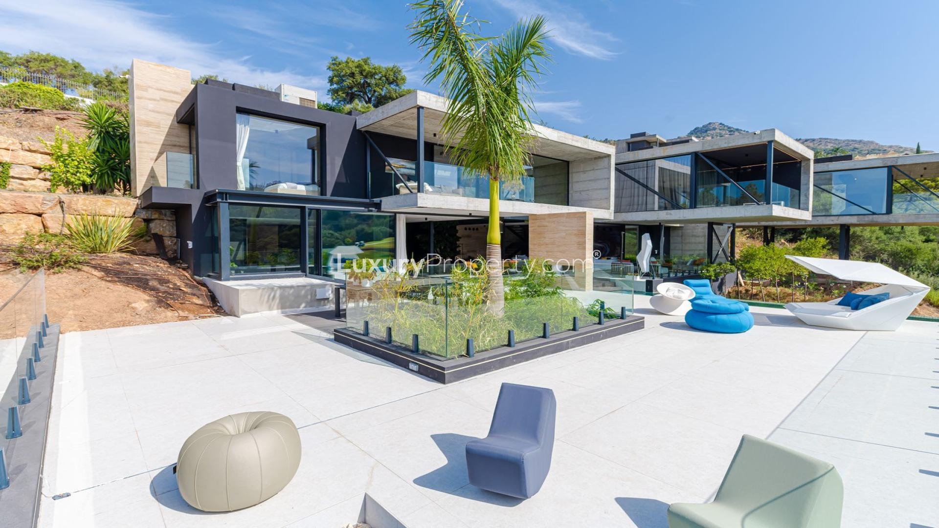 Luxury villa terrace with infinity pool overlooking Marbella Club Golf Resort in Benahavis