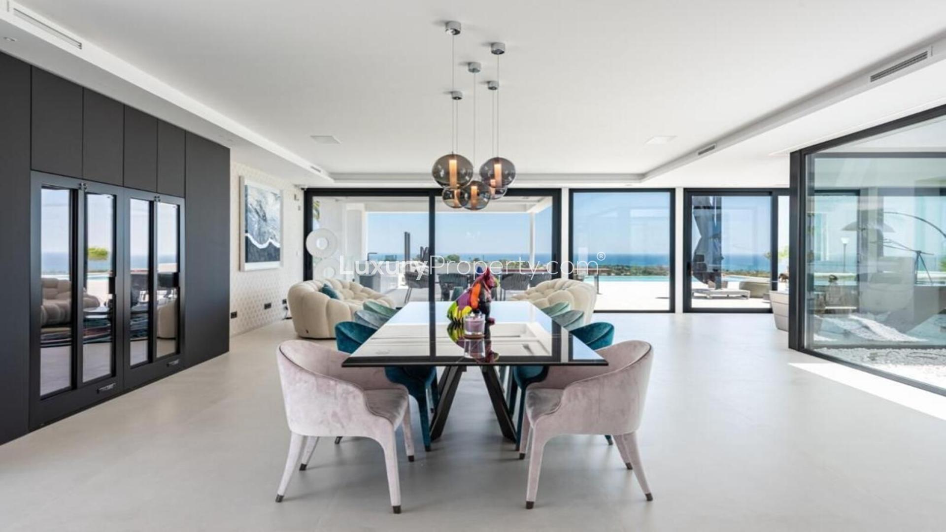 Panoramic sea view villa with modern design, lush garden, and spacious terrace in Málaga