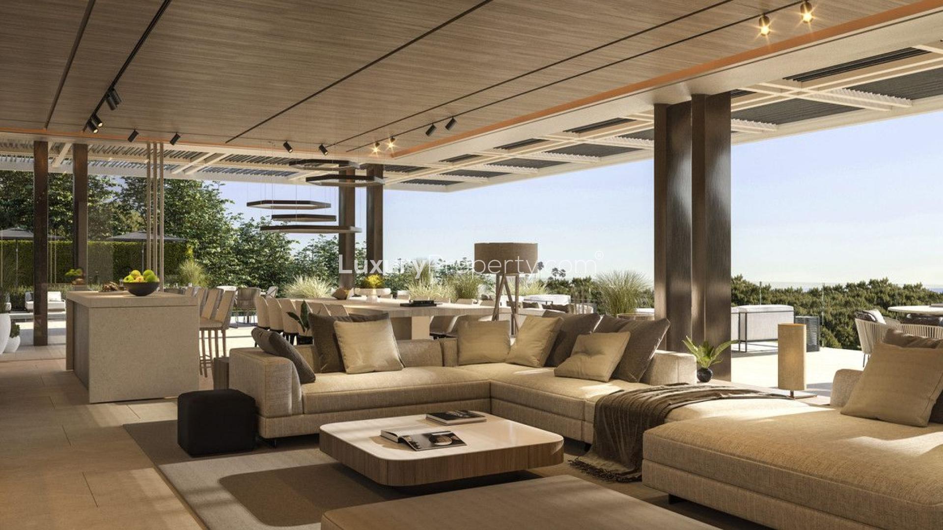 Luxurious outdoor terrace of modern golf-front villa in Benahavís, featuring elegant seating area