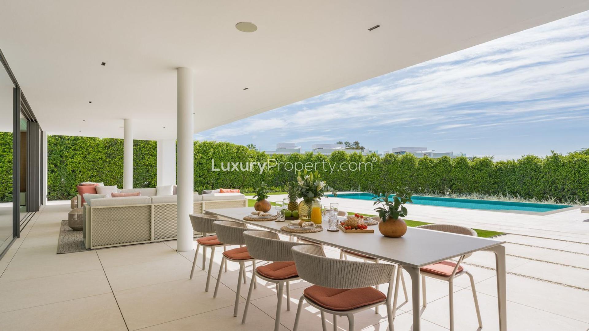 Outdoor living area with pool view at villa in The Golden Mile, Marbella