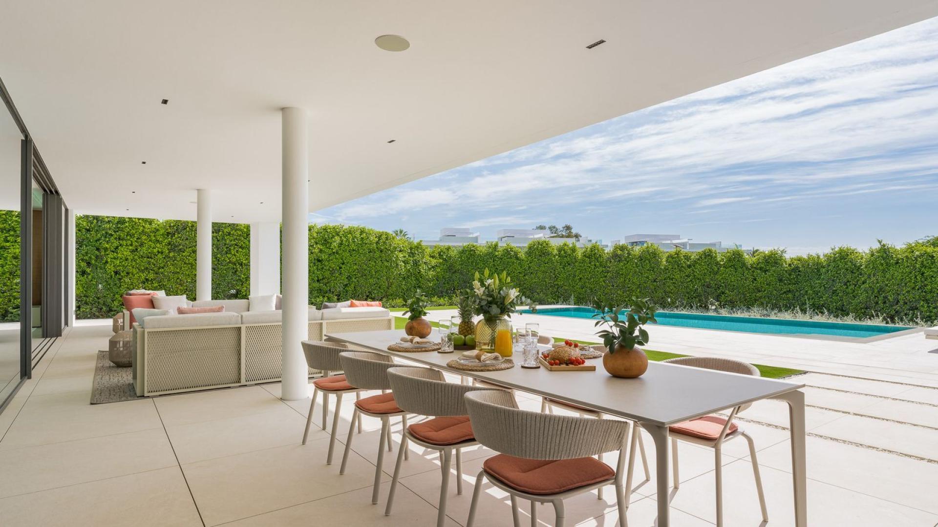 Outdoor living area with pool view at villa in The Golden Mile, Marbella