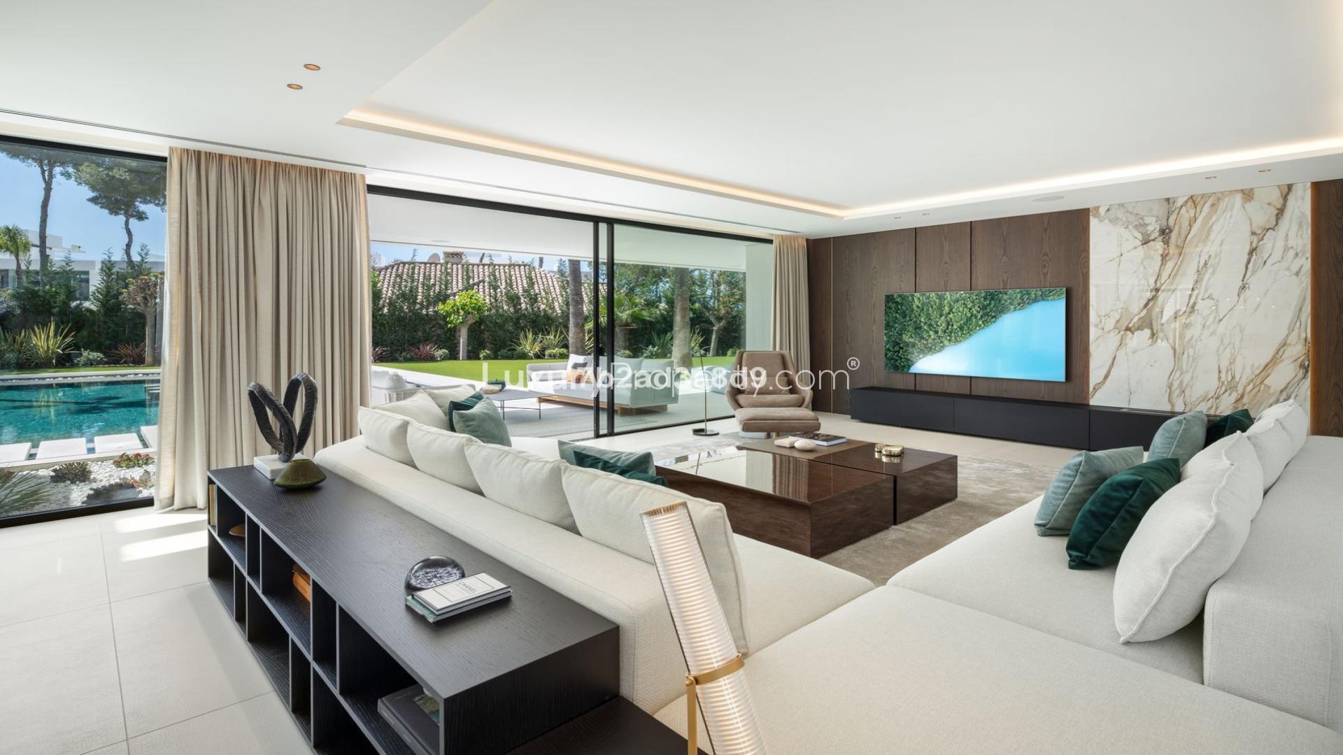 Luxurious living room in modern Nueva Andalucía villa, Marbella, with pool view