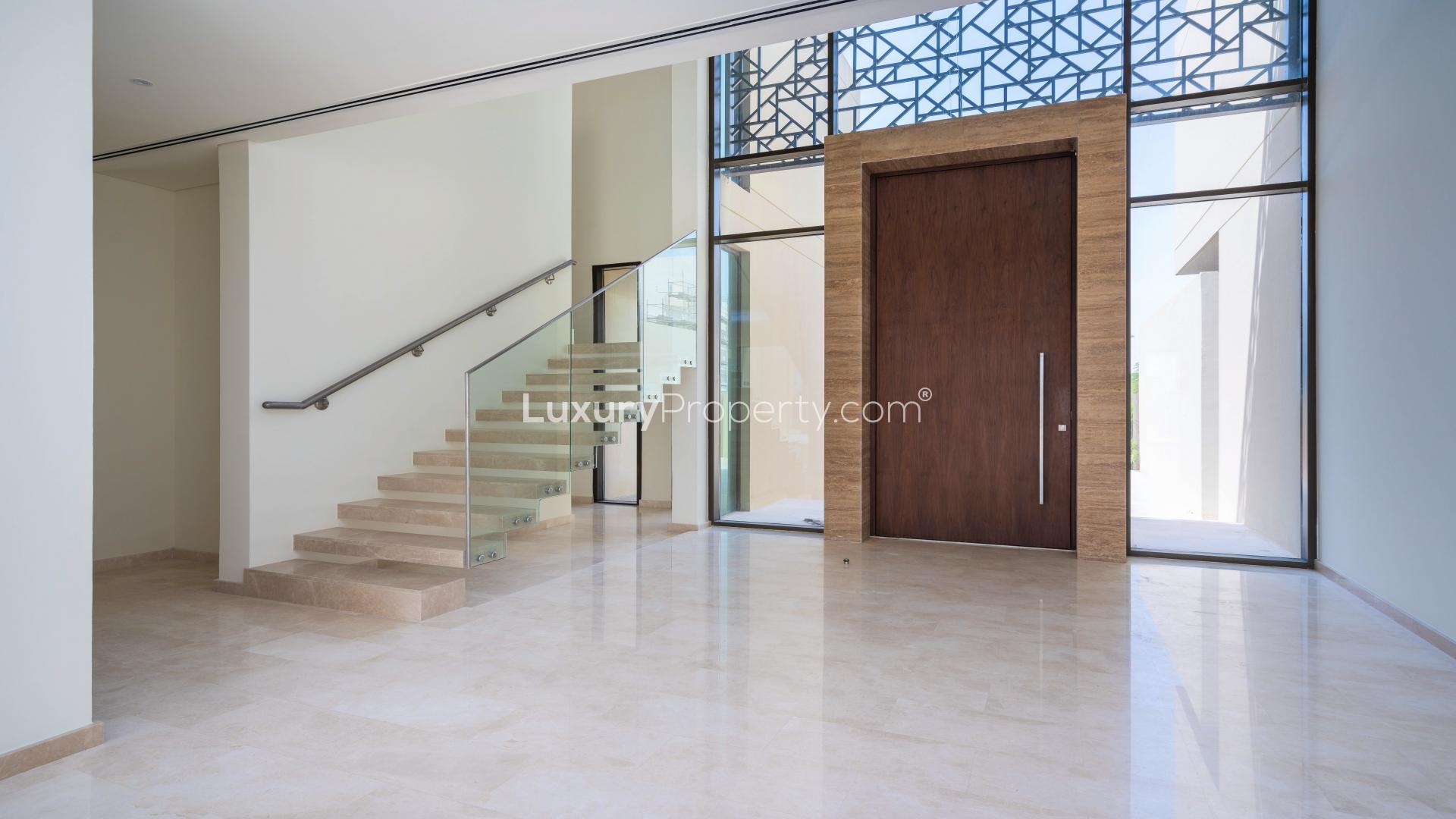 Brand new 5-bedroom villa exterior in Dubai Hills Estate, modern design, lush landscaping