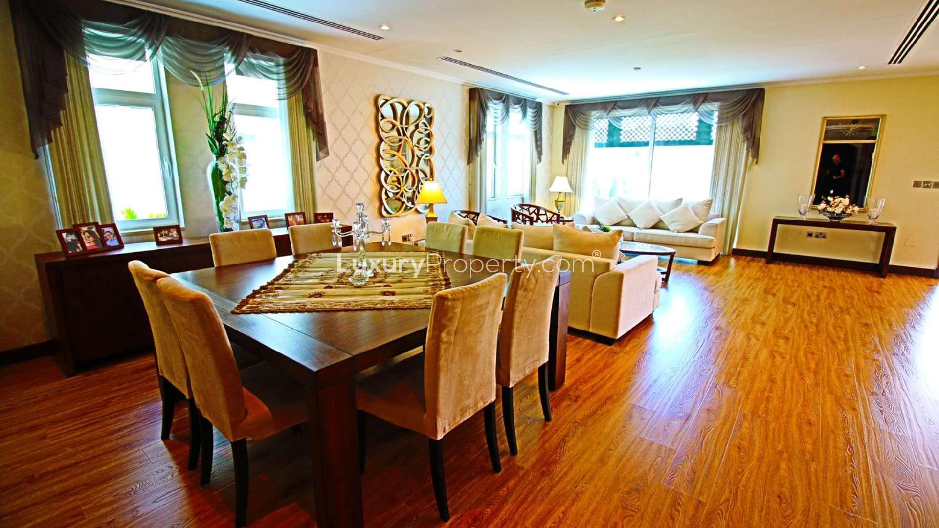 Luxurious 5-bedroom villa with illuminated pool at night, Jumeirah Park Regional. Rent now