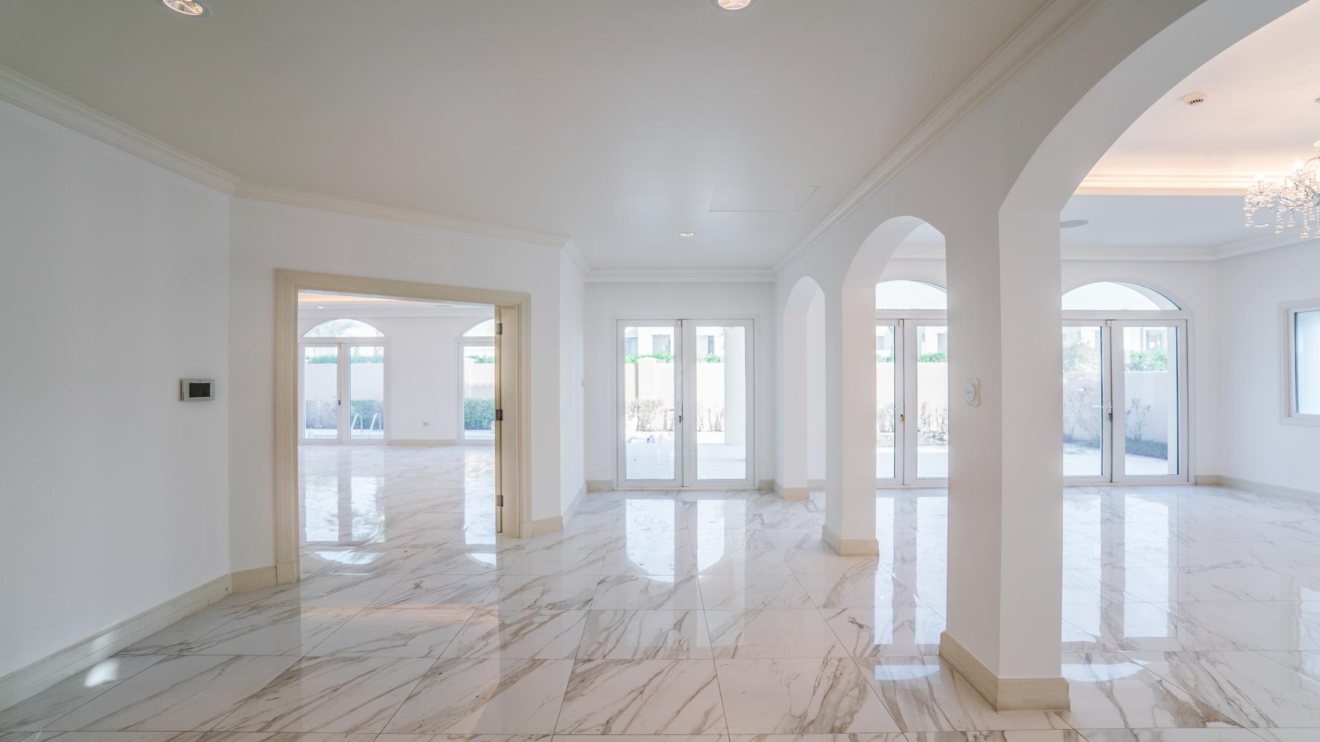 Front view of spacious 5-bedroom villa with driveway in Jumeirah Golf Estates, Fire community