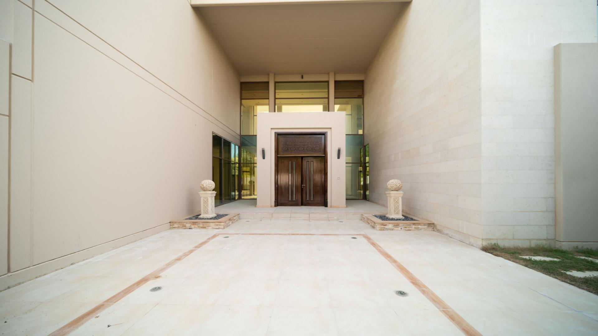 Exterior view of Meydan villa with landscaped garden and large windows for rent